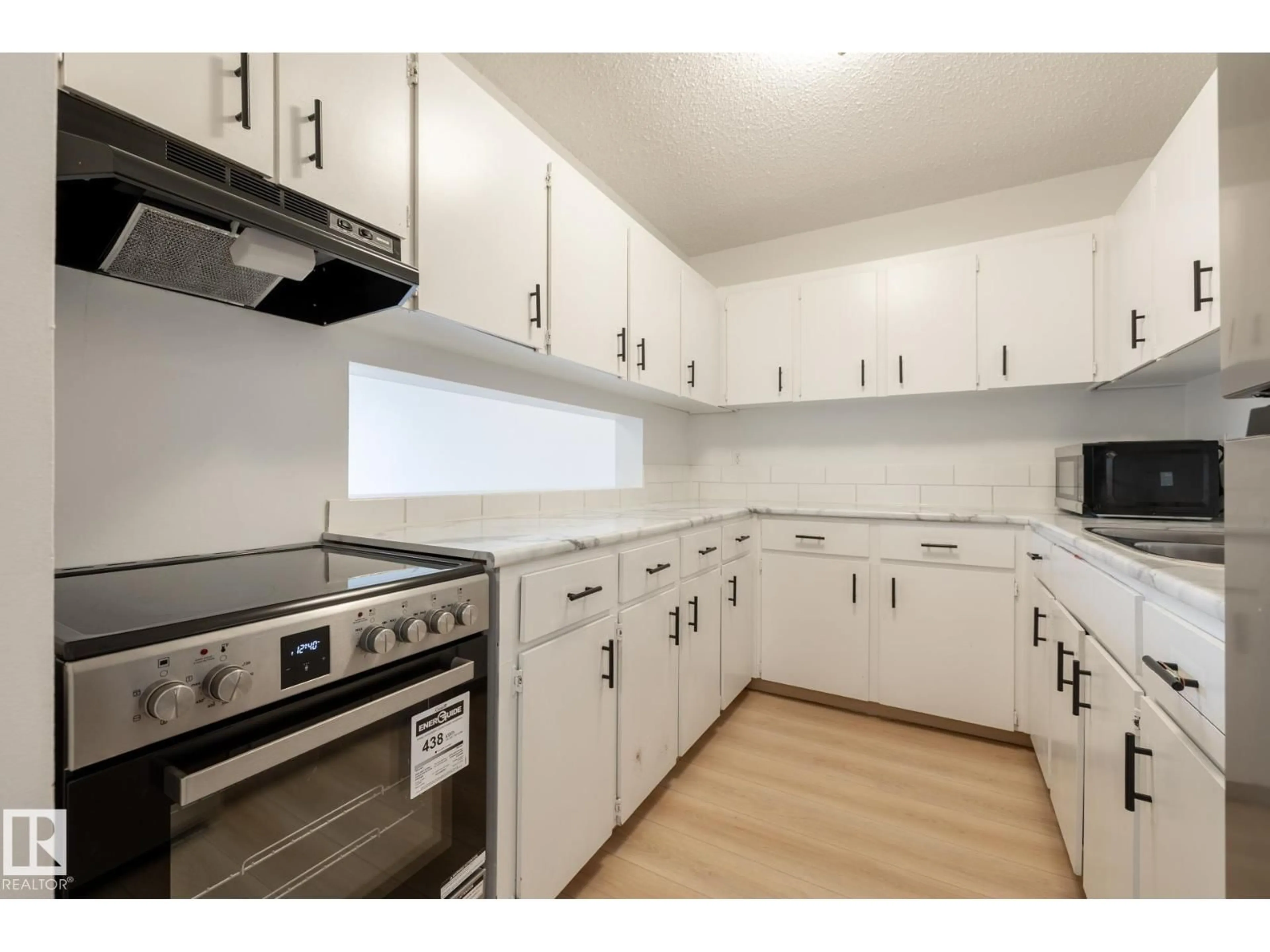Standard kitchen, wood/laminate floor for #303 - 10620 104 ST NW, Edmonton Alberta T5H2W2