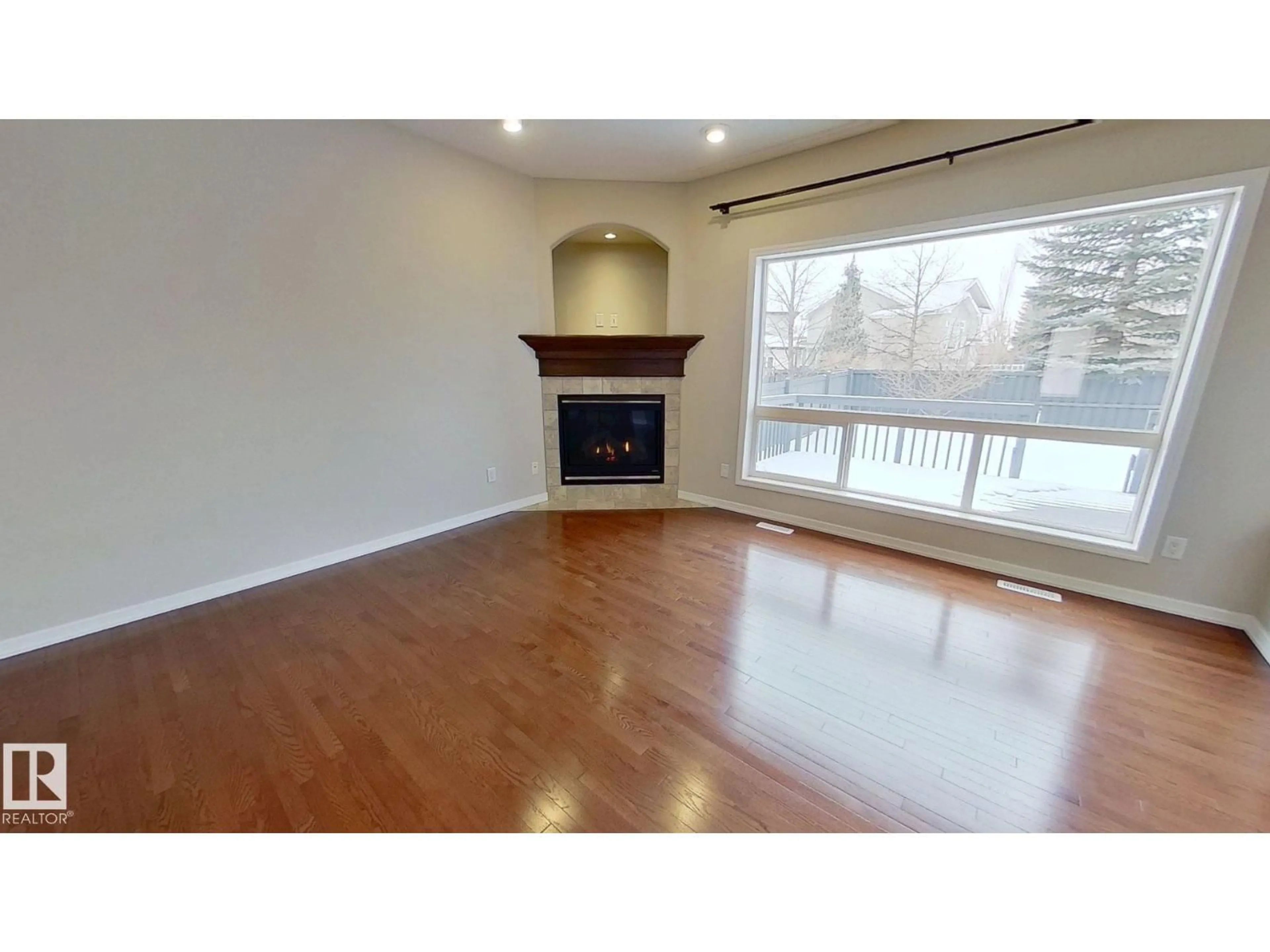 Living room with furniture, wood/laminate floor for 1157 TORY RD, Edmonton Alberta T6R3P2