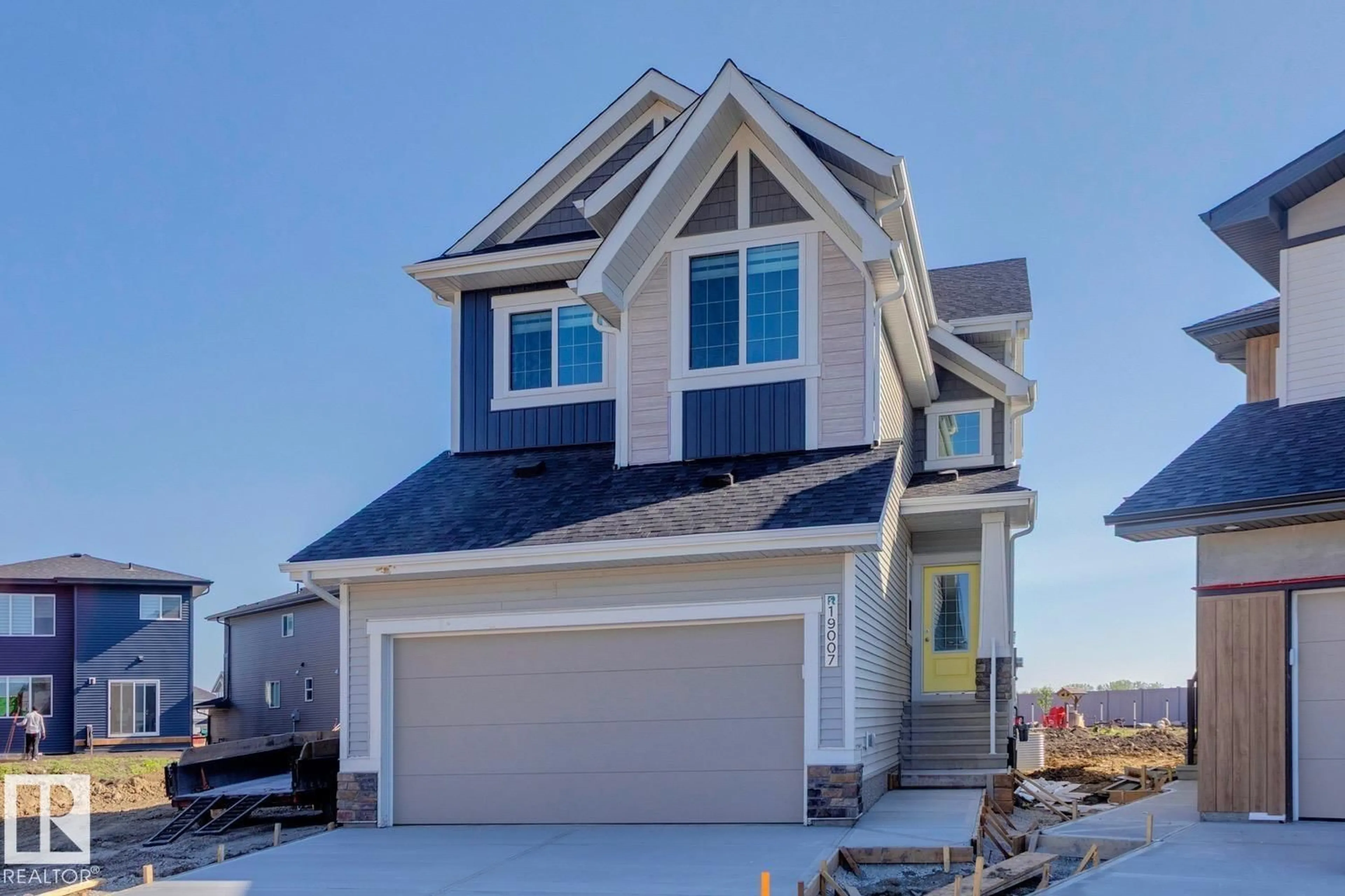 Home with vinyl exterior material, street for NW - 19007 20 AV, Edmonton Alberta T6M3E8