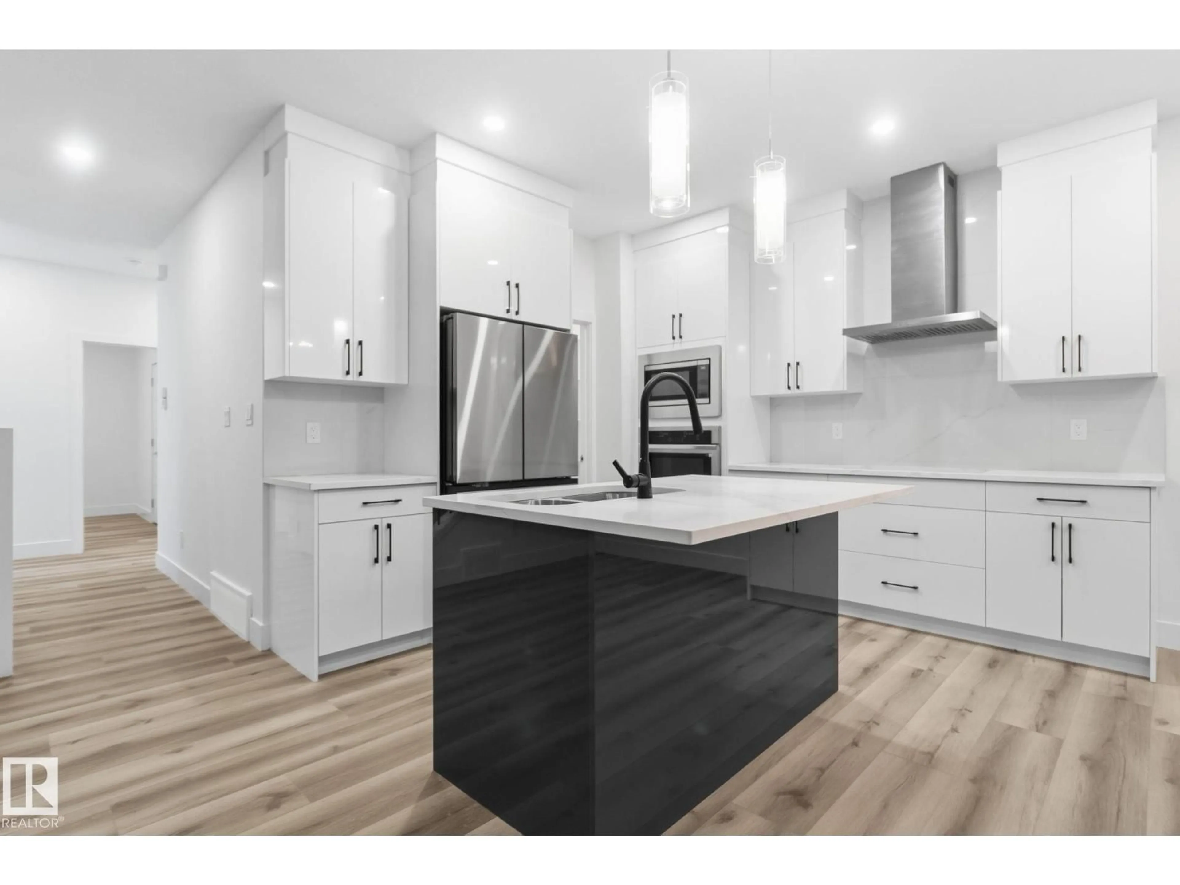 Open concept kitchen, wood/laminate floor for 2532 210 ST, Edmonton Alberta T6M2M7