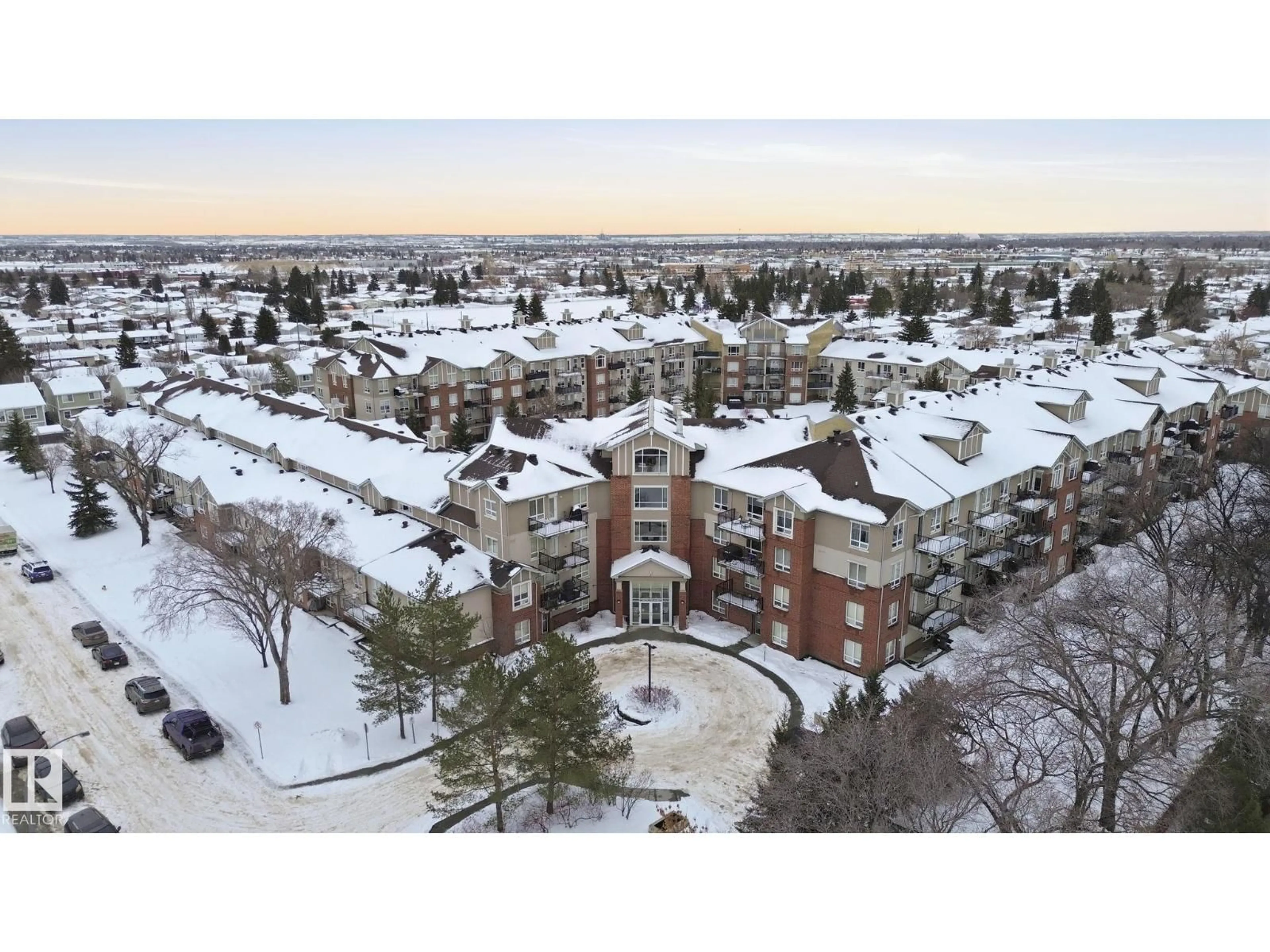 A pic from outside/outdoor area/front of a property/back of a property/a pic from drone, mountain view for #126 - 6315 135 AV, Edmonton Alberta T5A5J7