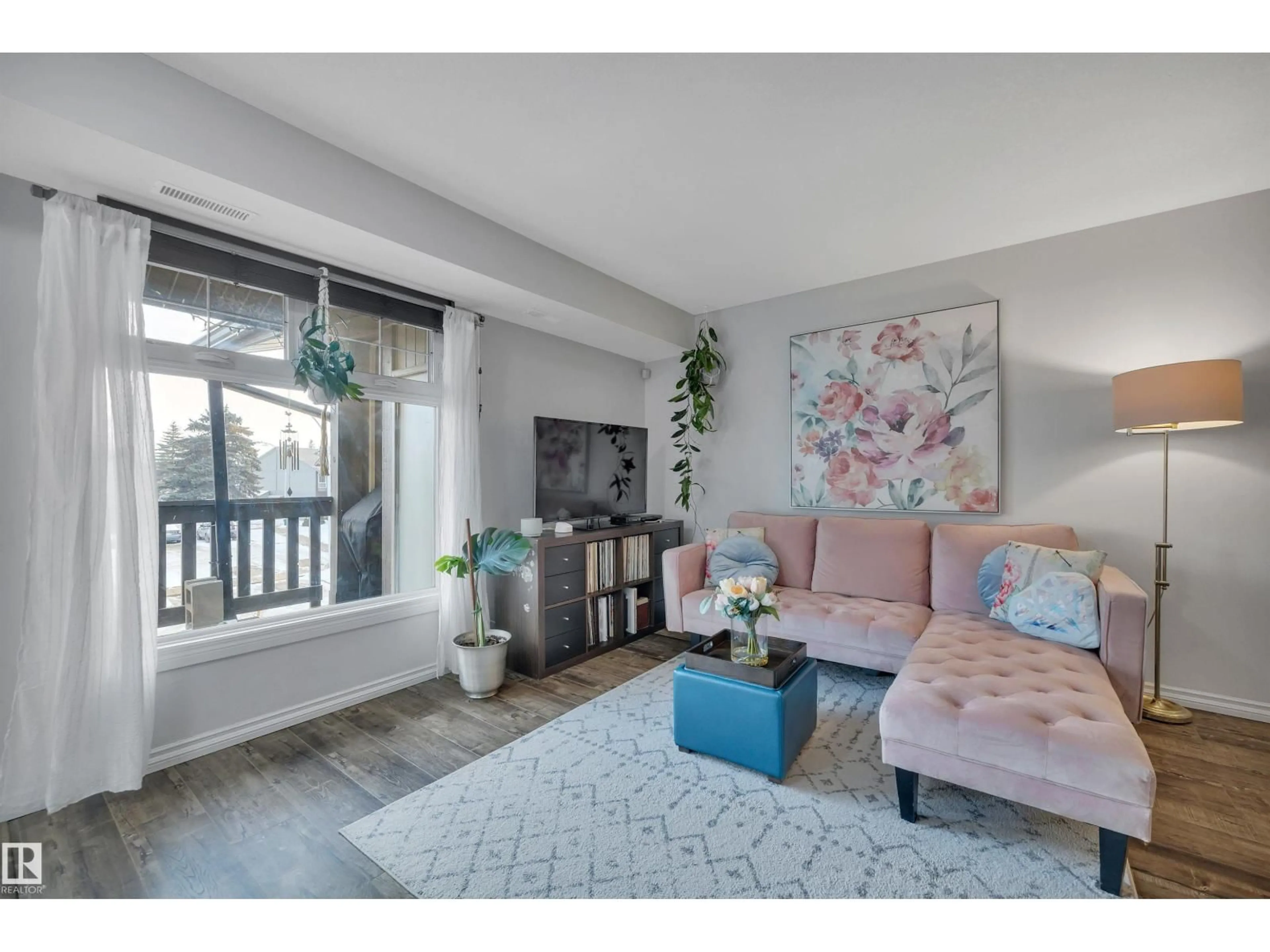 Living room with furniture, wood/laminate floor for 5926 172 ST, Edmonton Alberta T6M1B4