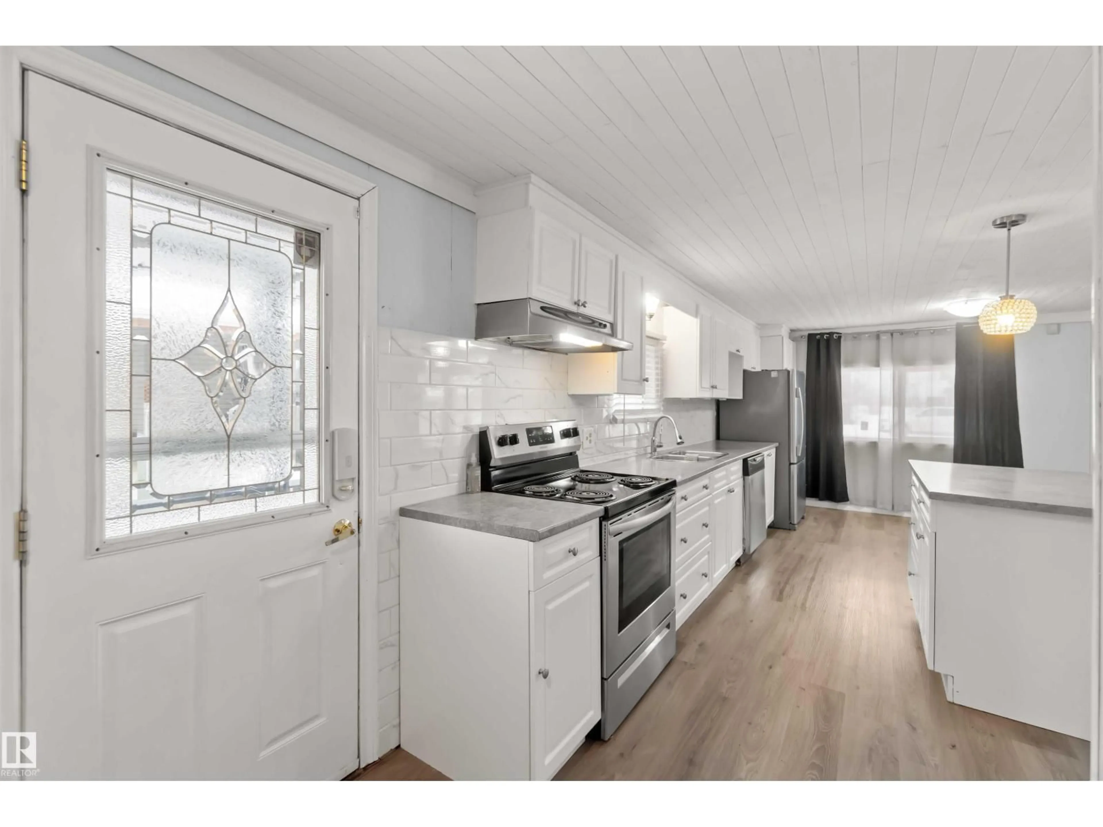 Open concept kitchen, wood/laminate floor for 5021 53 AV, Wabamun Alberta T0E2K0