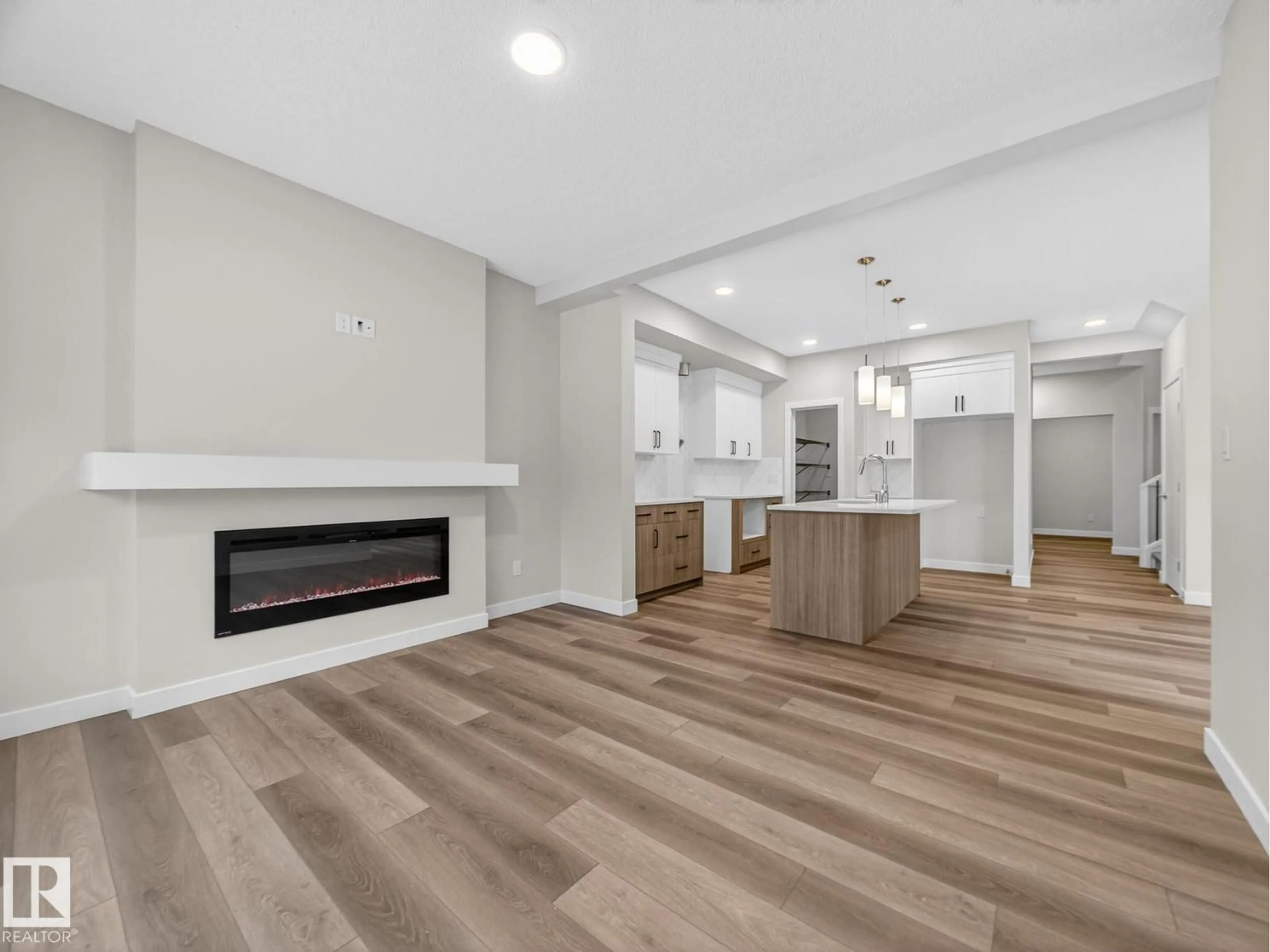 Open concept kitchen, wood/laminate floor for 364 BLUFF CV, Leduc Alberta T9E1S2