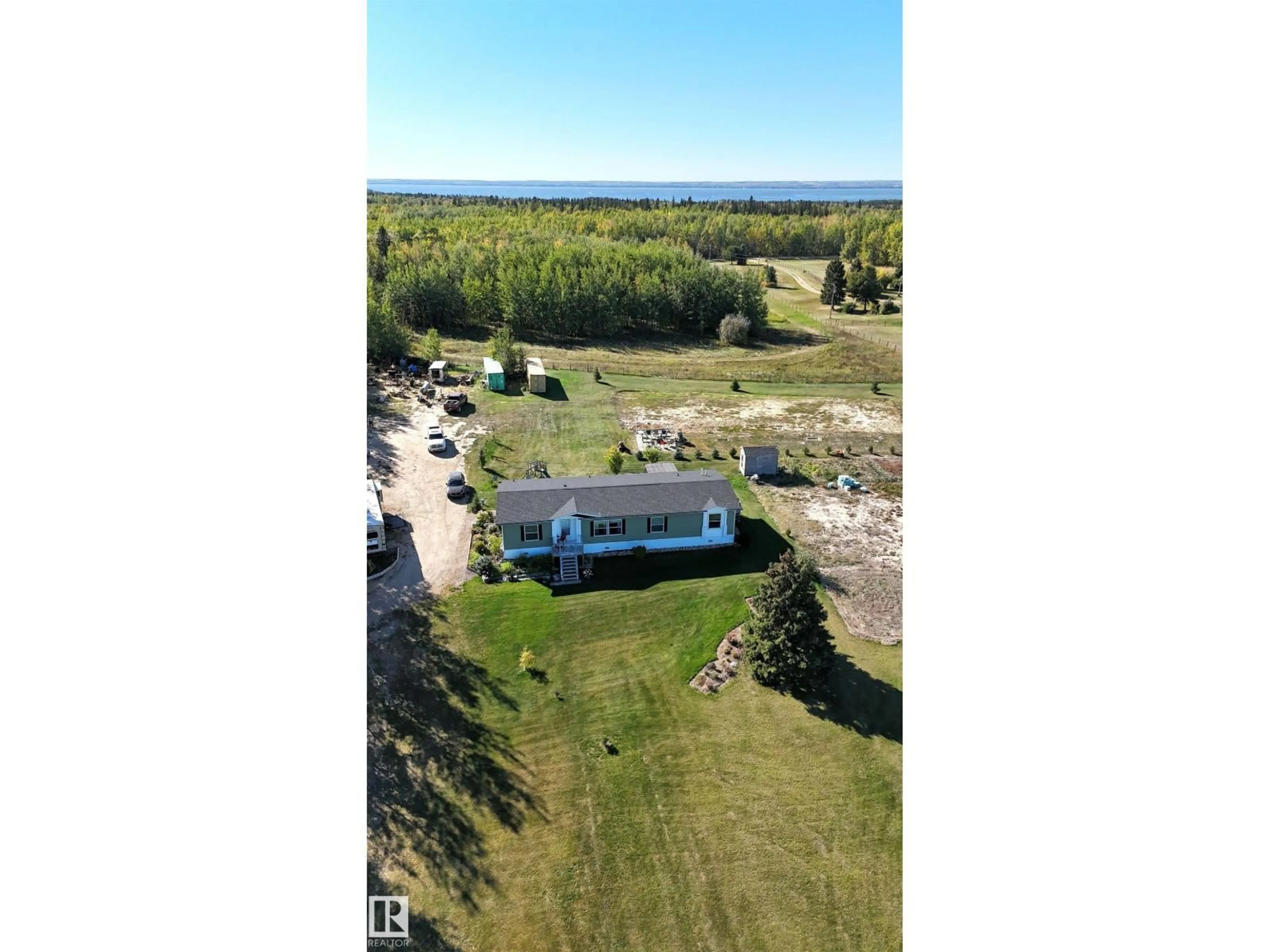 A pic from outside/outdoor area/front of a property/back of a property/a pic from drone, water/lake/river/ocean view for 201 GLENHAVEN CR, Rural Wetaskiwin County Alberta T0C2C0