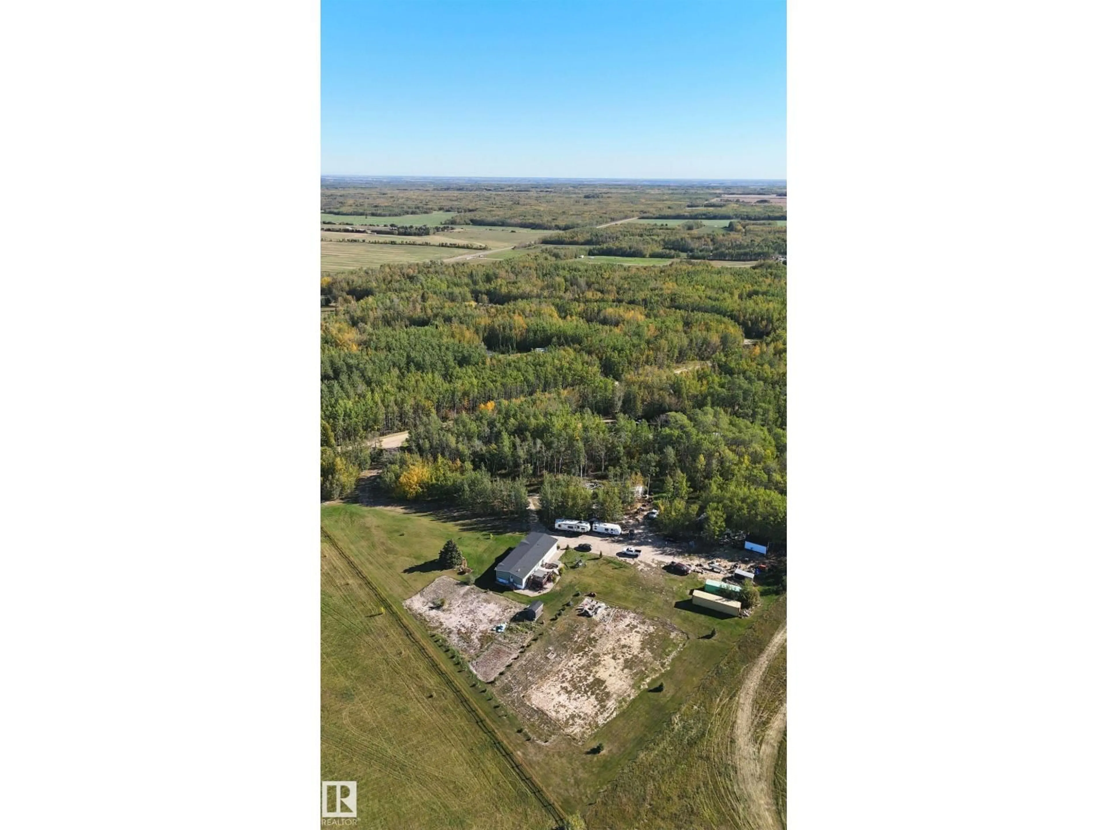 A pic from outside/outdoor area/front of a property/back of a property/a pic from drone, building for 201 GLENHAVEN CR, Rural Wetaskiwin County Alberta T0C2C0