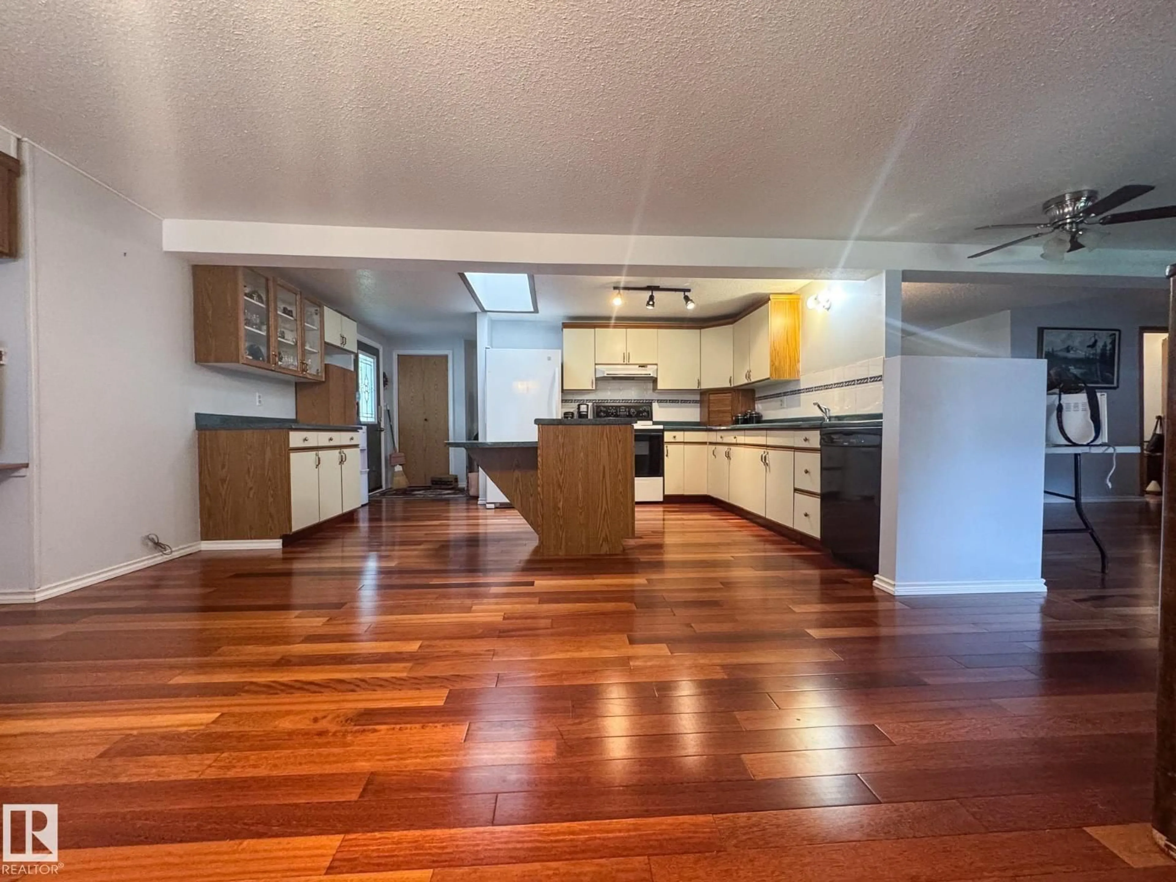 Open concept kitchen, wood/laminate floor for 27 AUTTREAUX DR, Whitecourt Alberta T7S1C8