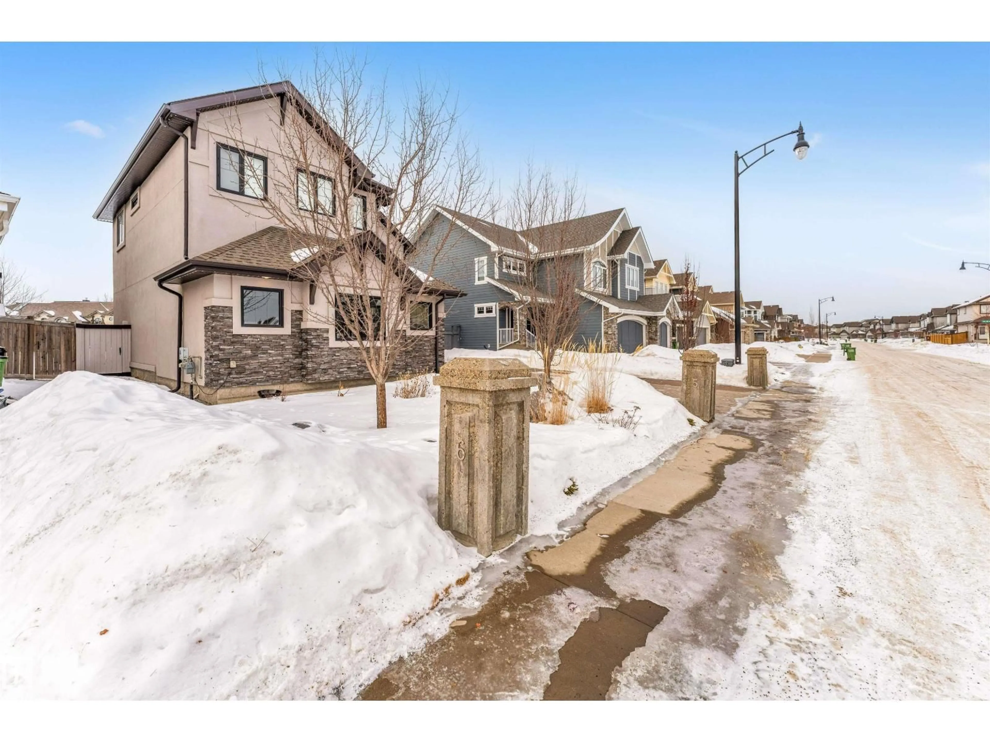 A pic from outside/outdoor area/front of a property/back of a property/a pic from drone, street for 656 180 ST, Edmonton Alberta T6W2T1