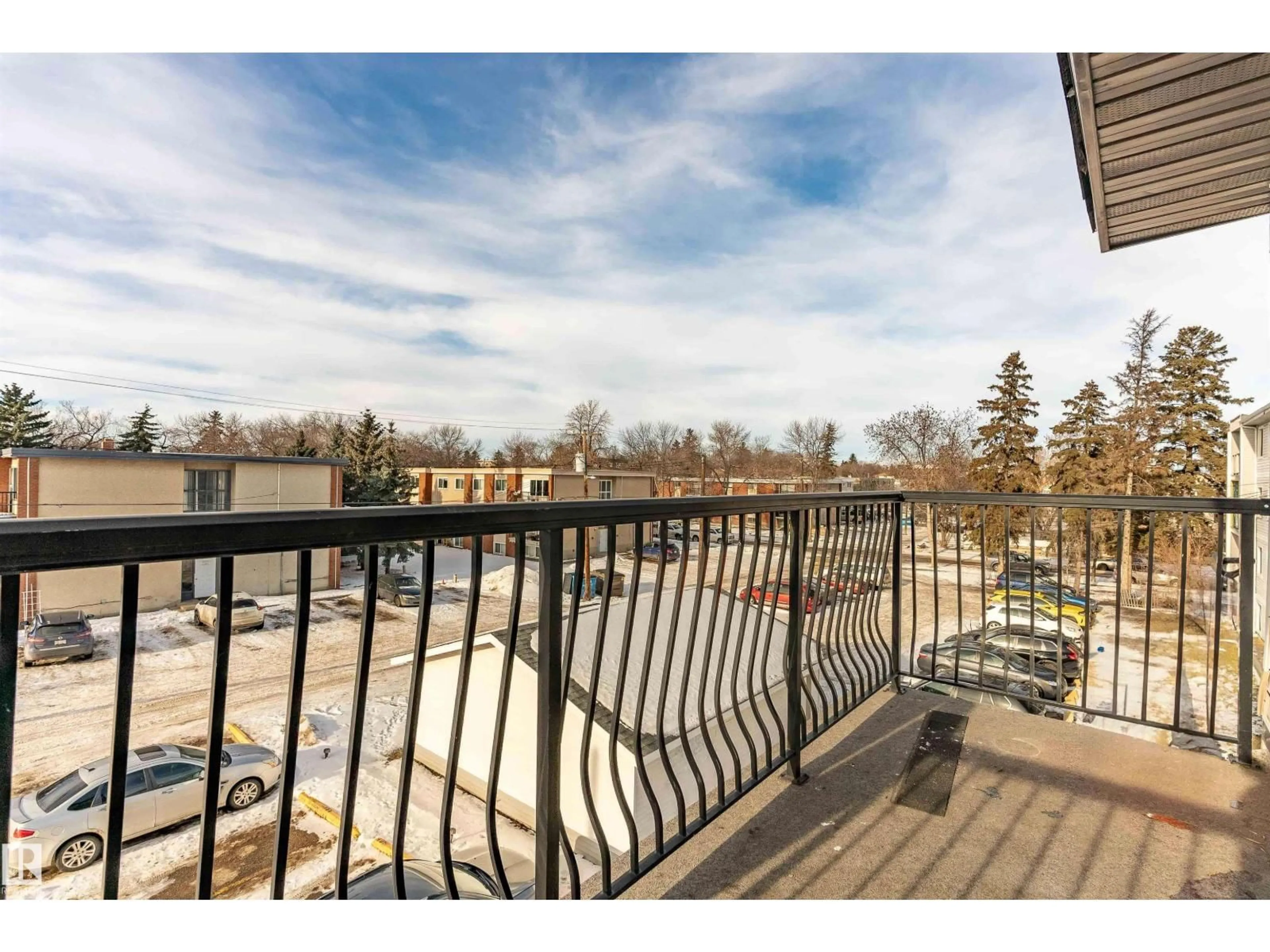 Patio, city buildings view from balcony for 10730 112 ST NW, Edmonton Alberta T5H3H1