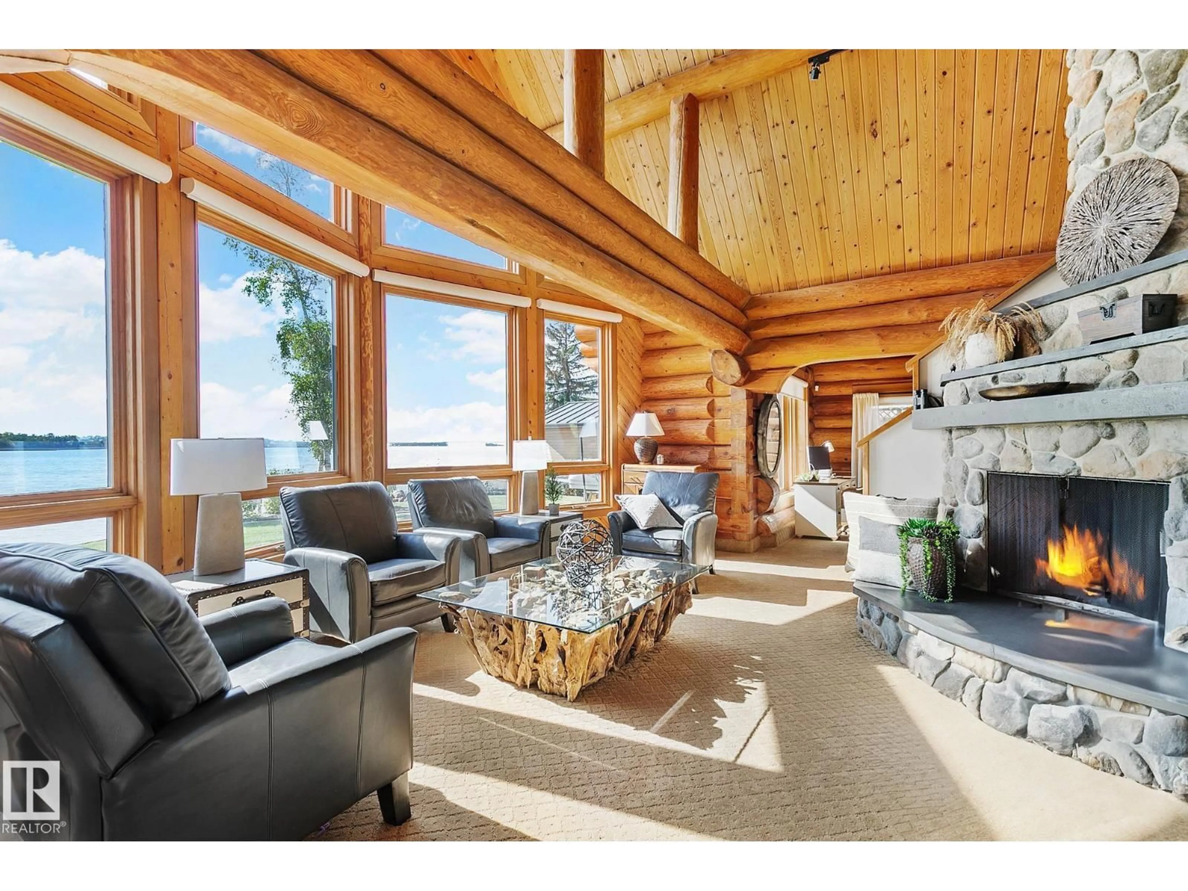 Living room with furniture, wood/laminate floor for 1 MARTIN RD, Rural Lac Ste. Anne County Alberta T0E1A0