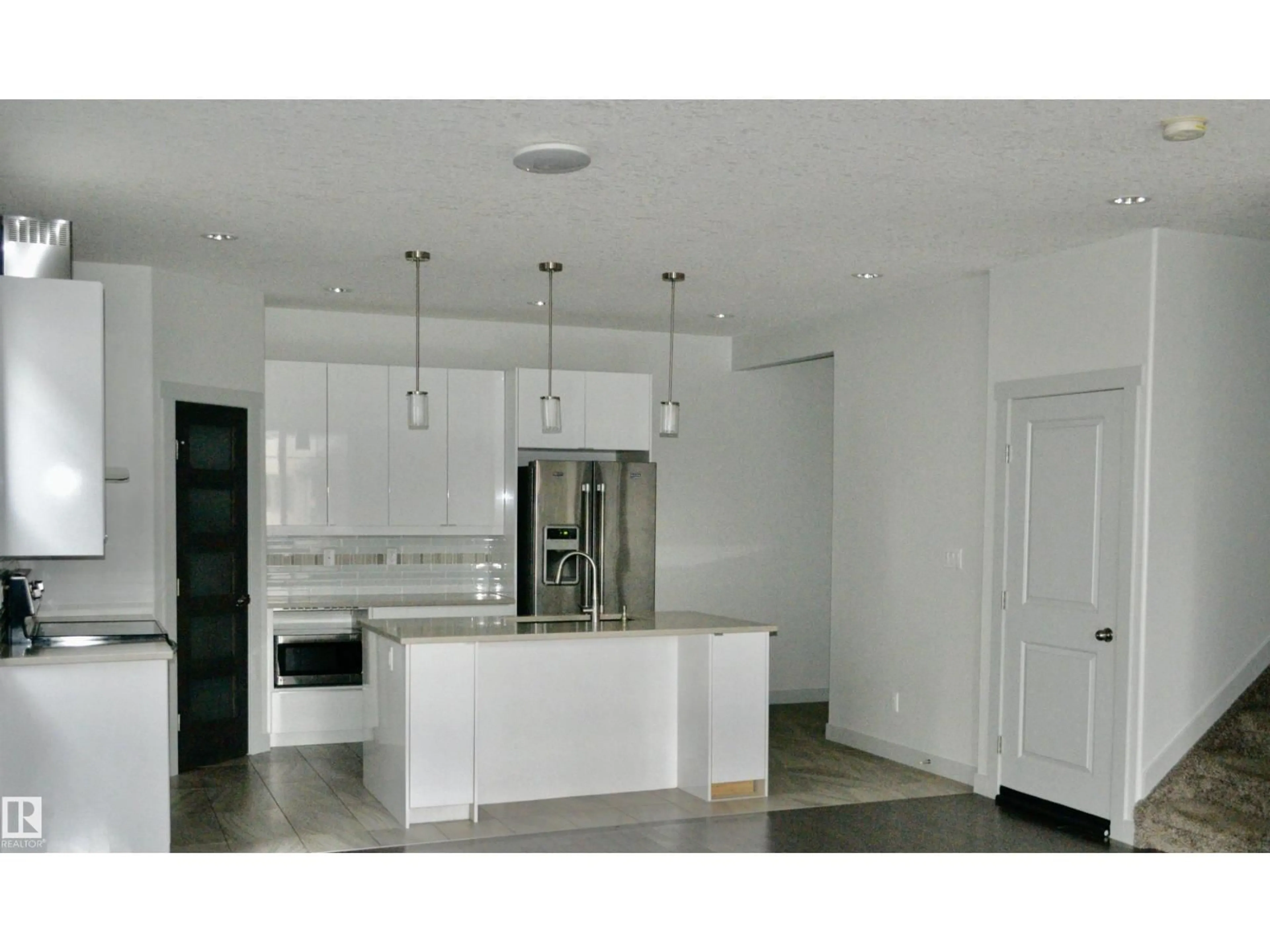 Open concept kitchen, ceramic/tile floor for 8950 81 AV, Edmonton Alberta T6C0W8