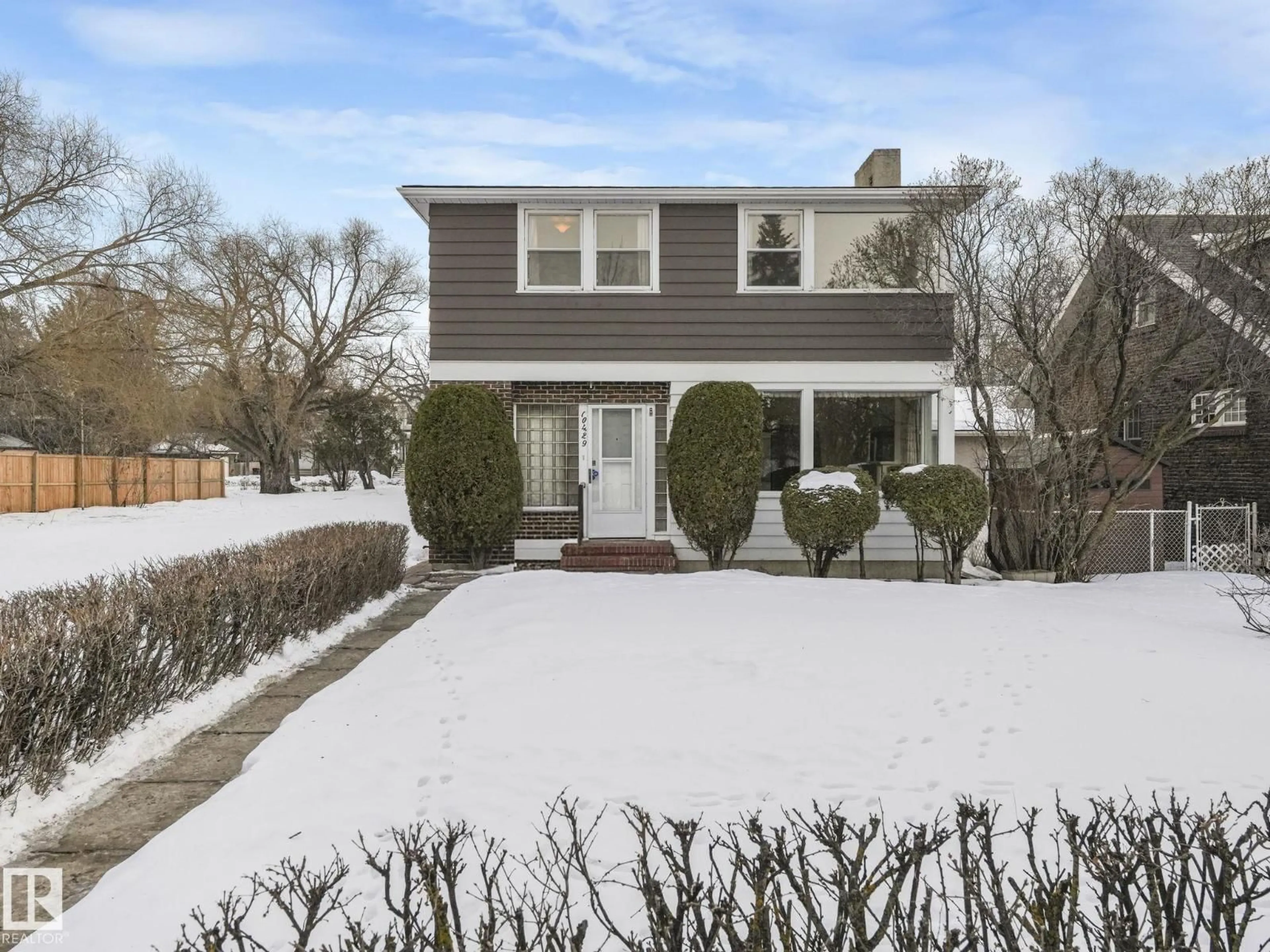 Home with vinyl exterior material, street for 10429 SASKATCHEWAN DR, Edmonton Alberta T6E4R8