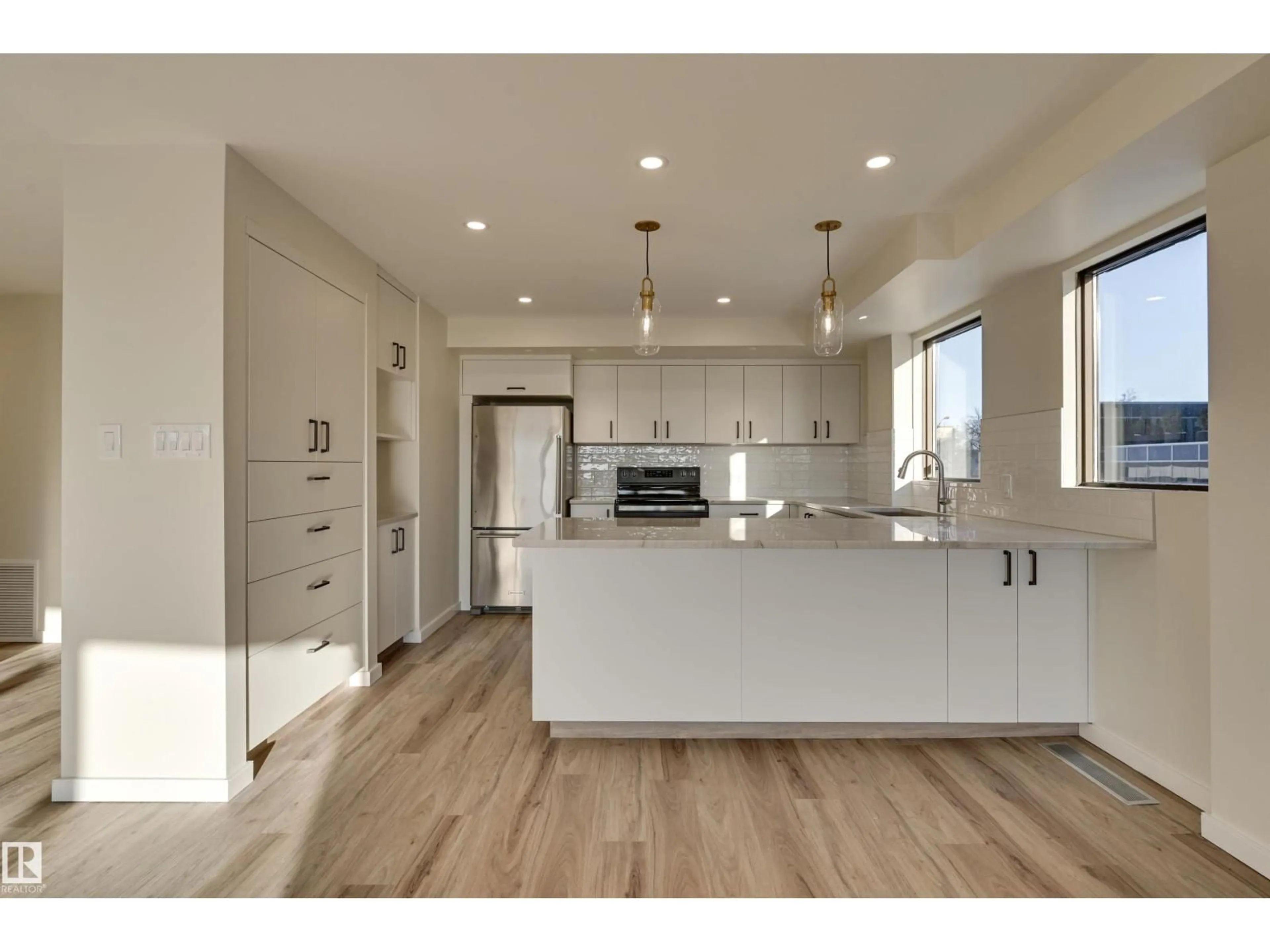 Open concept kitchen, wood/laminate floor for 11960 100 AV, Edmonton Alberta T5K0K5