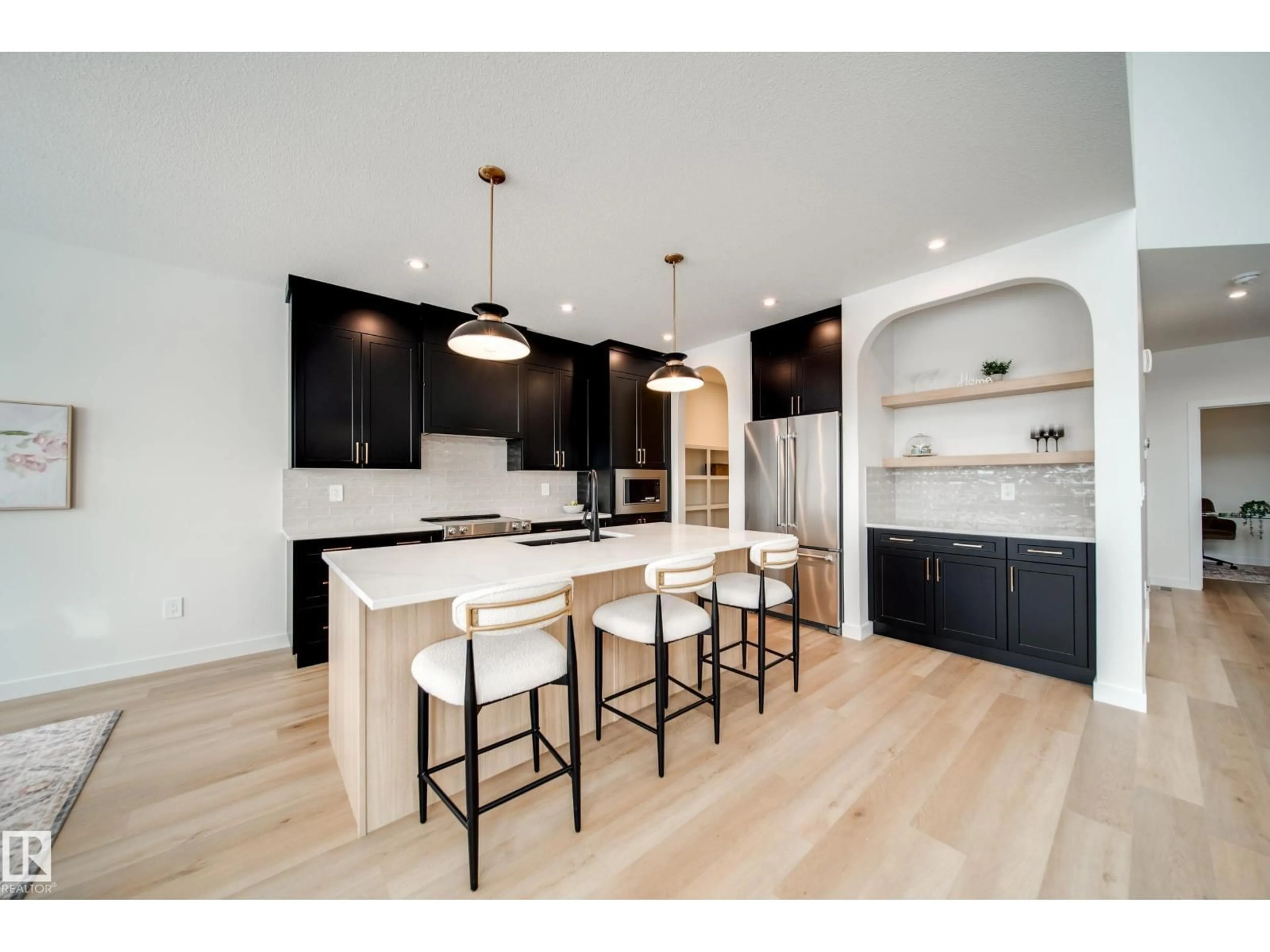 Open concept kitchen, wood/laminate floor for 4 CLOUTIER CL, St. Albert Alberta T8T2C9