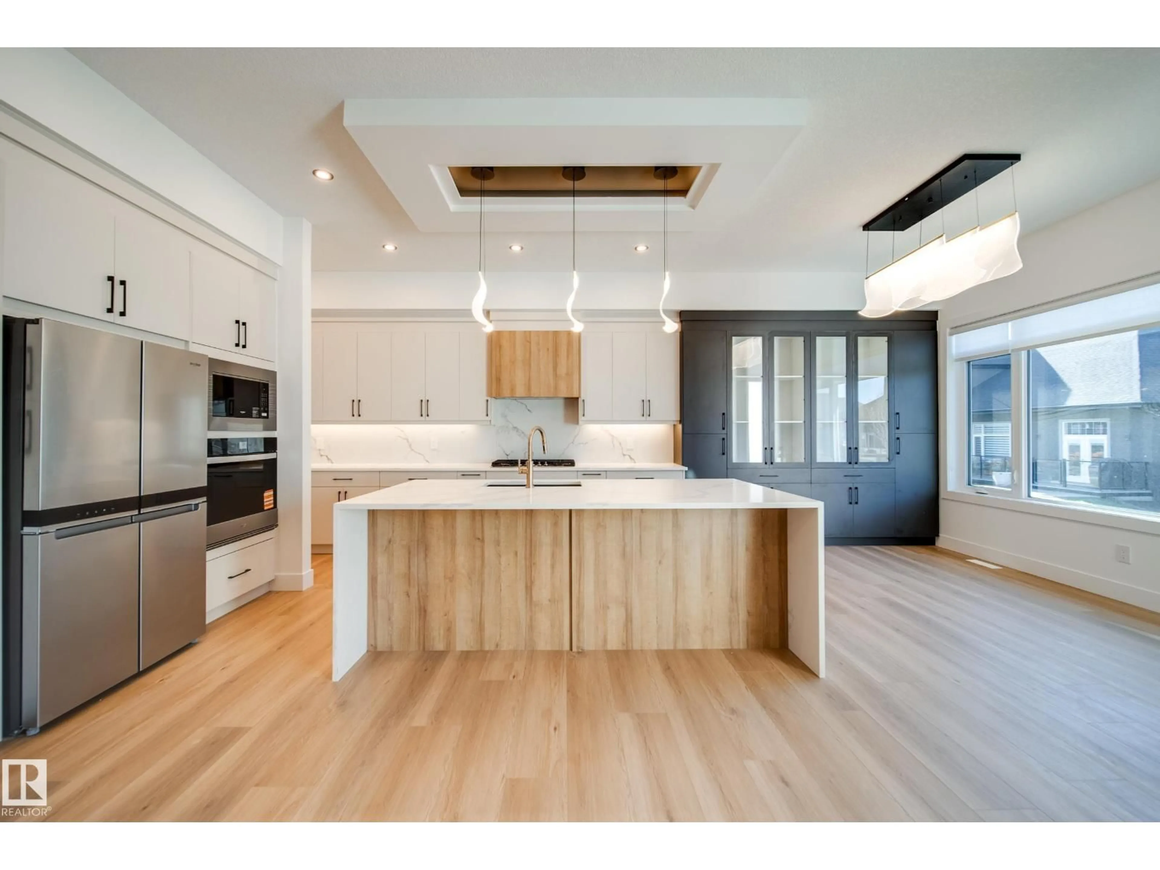 Open concept kitchen, wood/laminate floor for #42 - 20425 93 AV, Edmonton Alberta T5T7C7