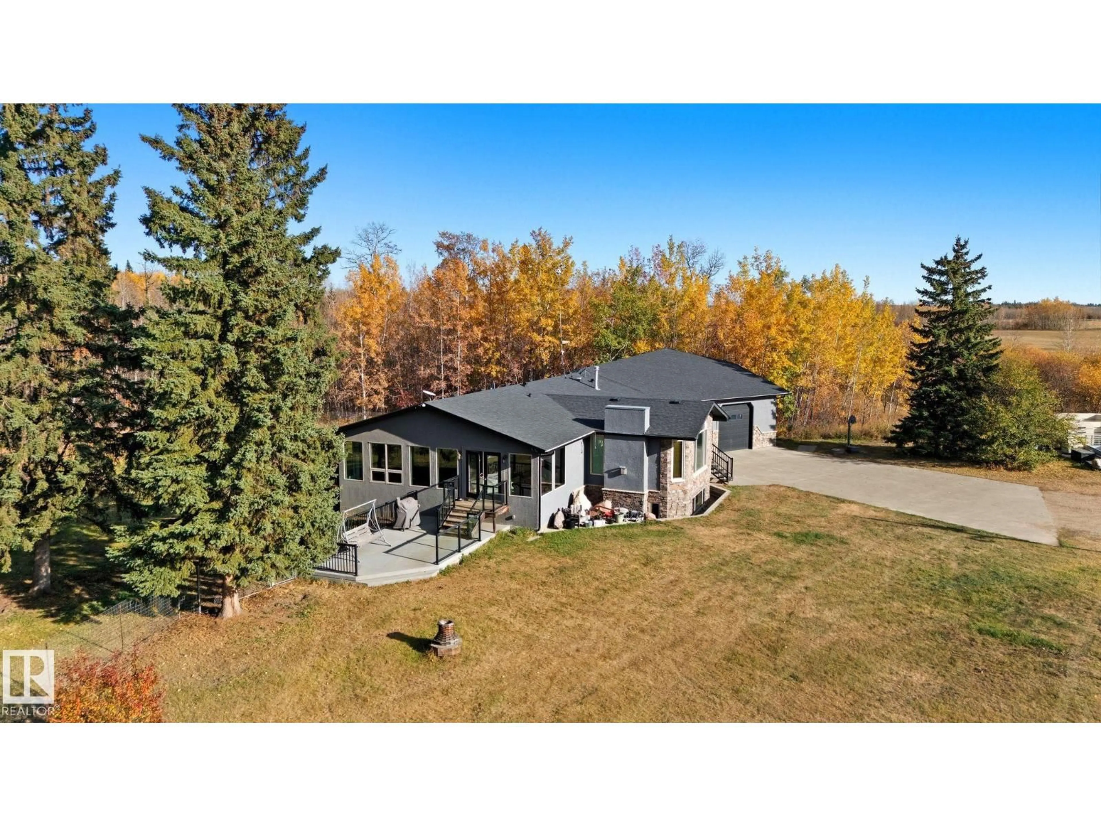 A pic from outside/outdoor area/front of a property/back of a property/a pic from drone, unknown for 22516 TWP ROAD 572, Rural Sturgeon County Alberta T0A1N5