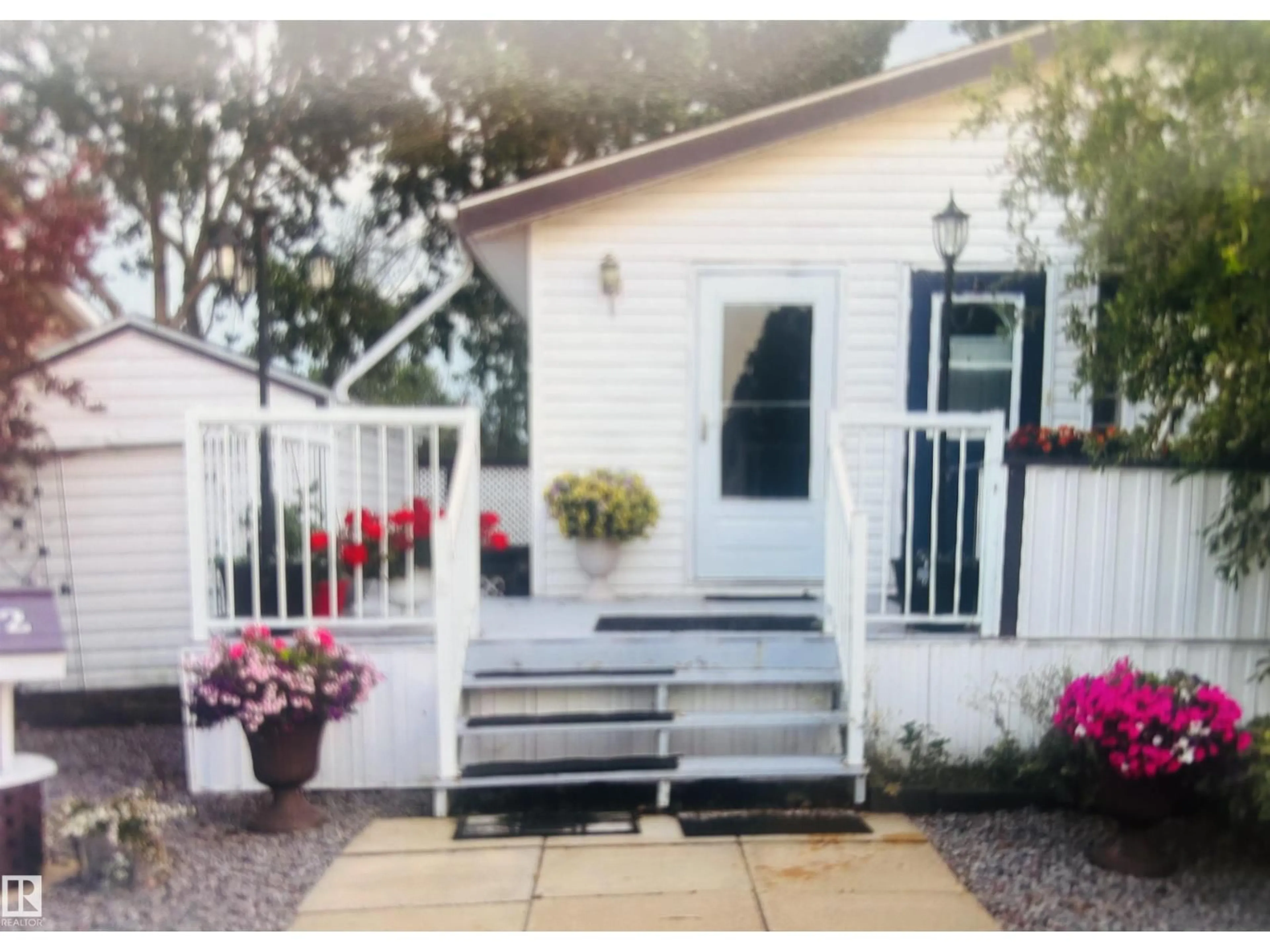 Home with vinyl exterior material, street for 53222 - 1222 RR 272, Rural Parkland County Alberta T7X4K4