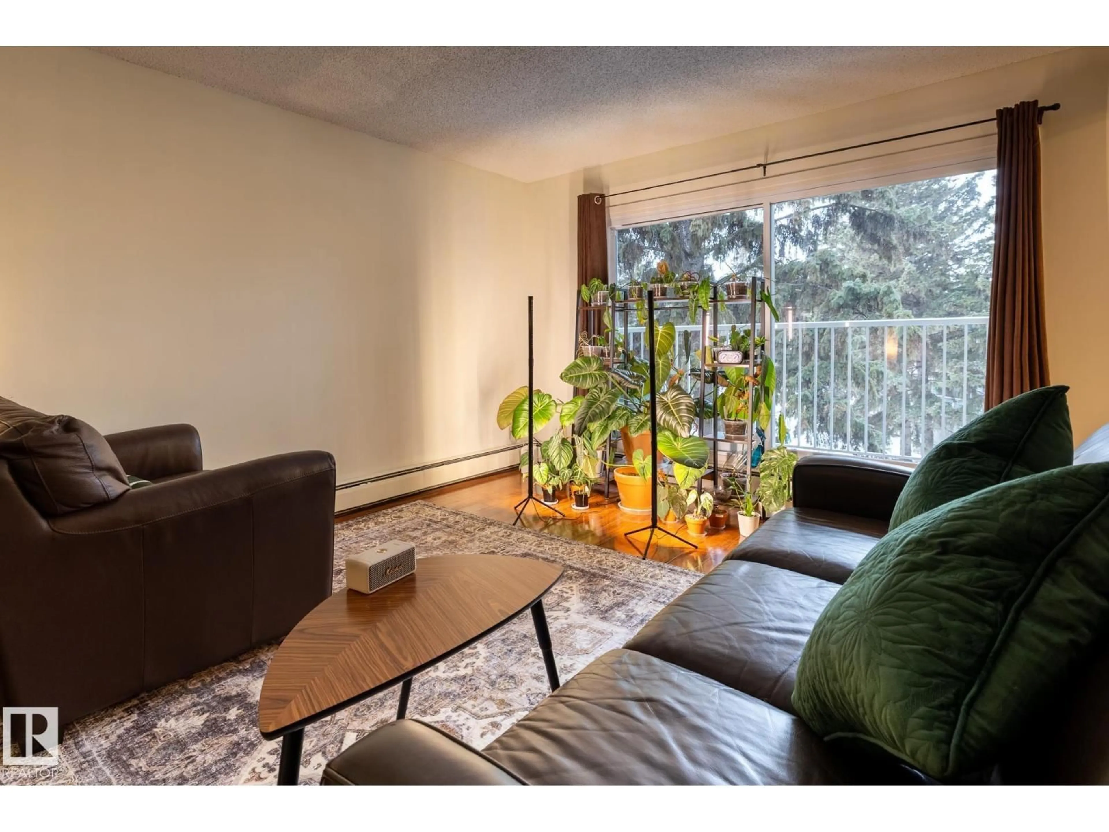 Living room with furniture, wood/laminate floor for #307 - 5730 RIVERBEND RD, Edmonton Alberta T6H4H4