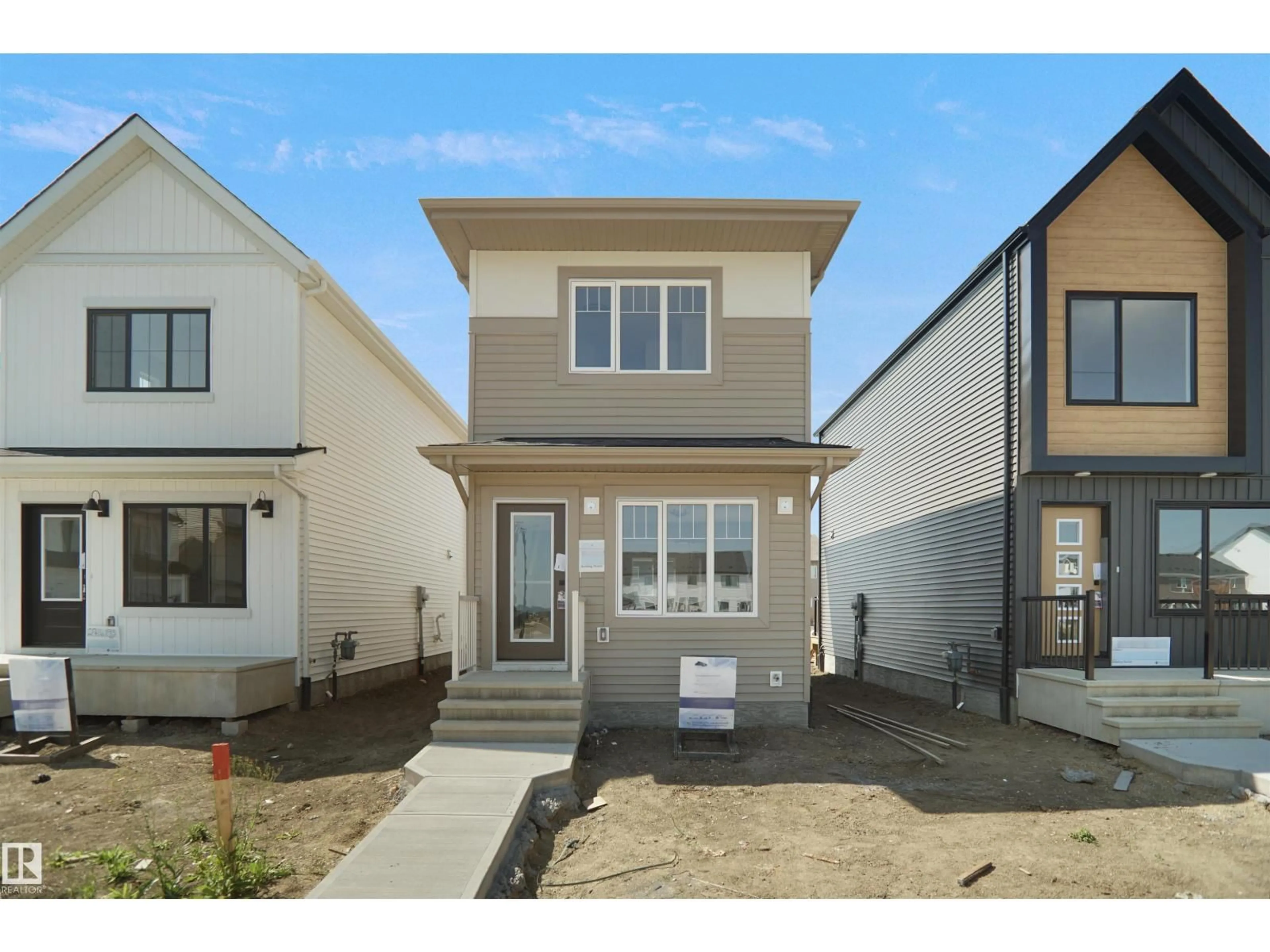 Home with vinyl exterior material, street for 2115 210 ST, Edmonton Alberta T6M3H6