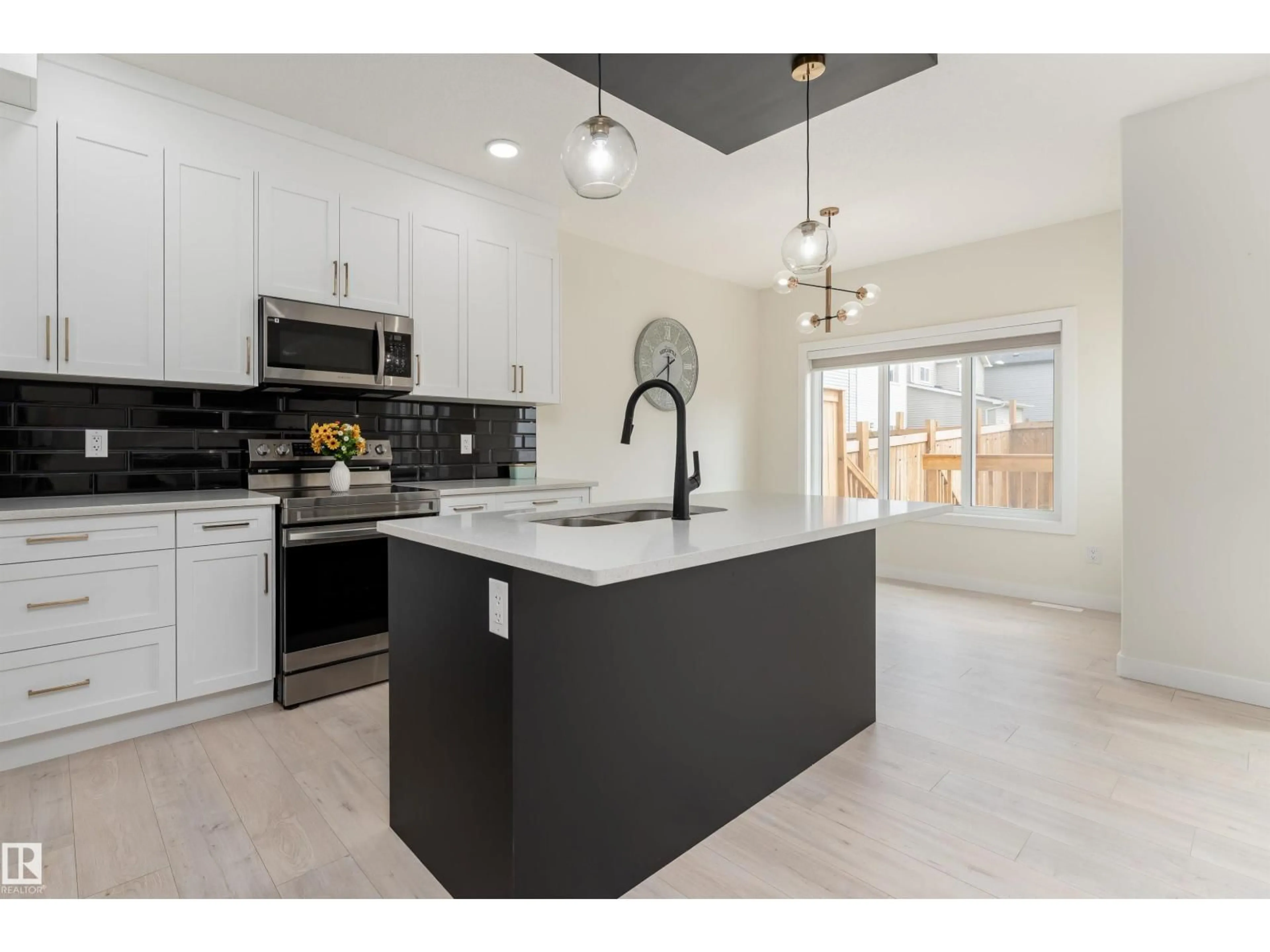 Open concept kitchen, ceramic/tile floor for 112 BLUFF CV, Leduc Alberta T9E1M8