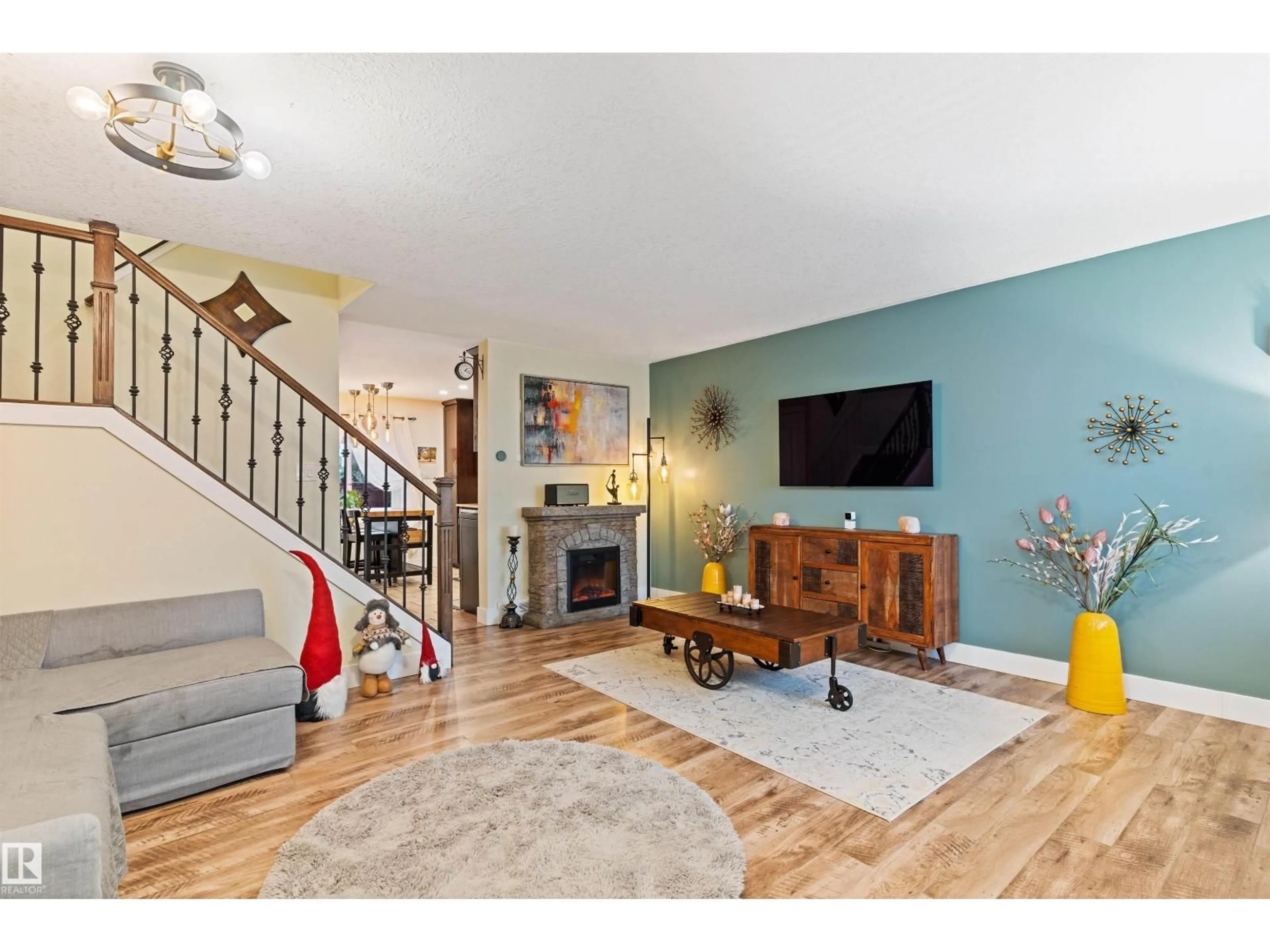Living room with furniture, wood/laminate floor for NW - 7923 178 ST, Edmonton Alberta T5T1L3
