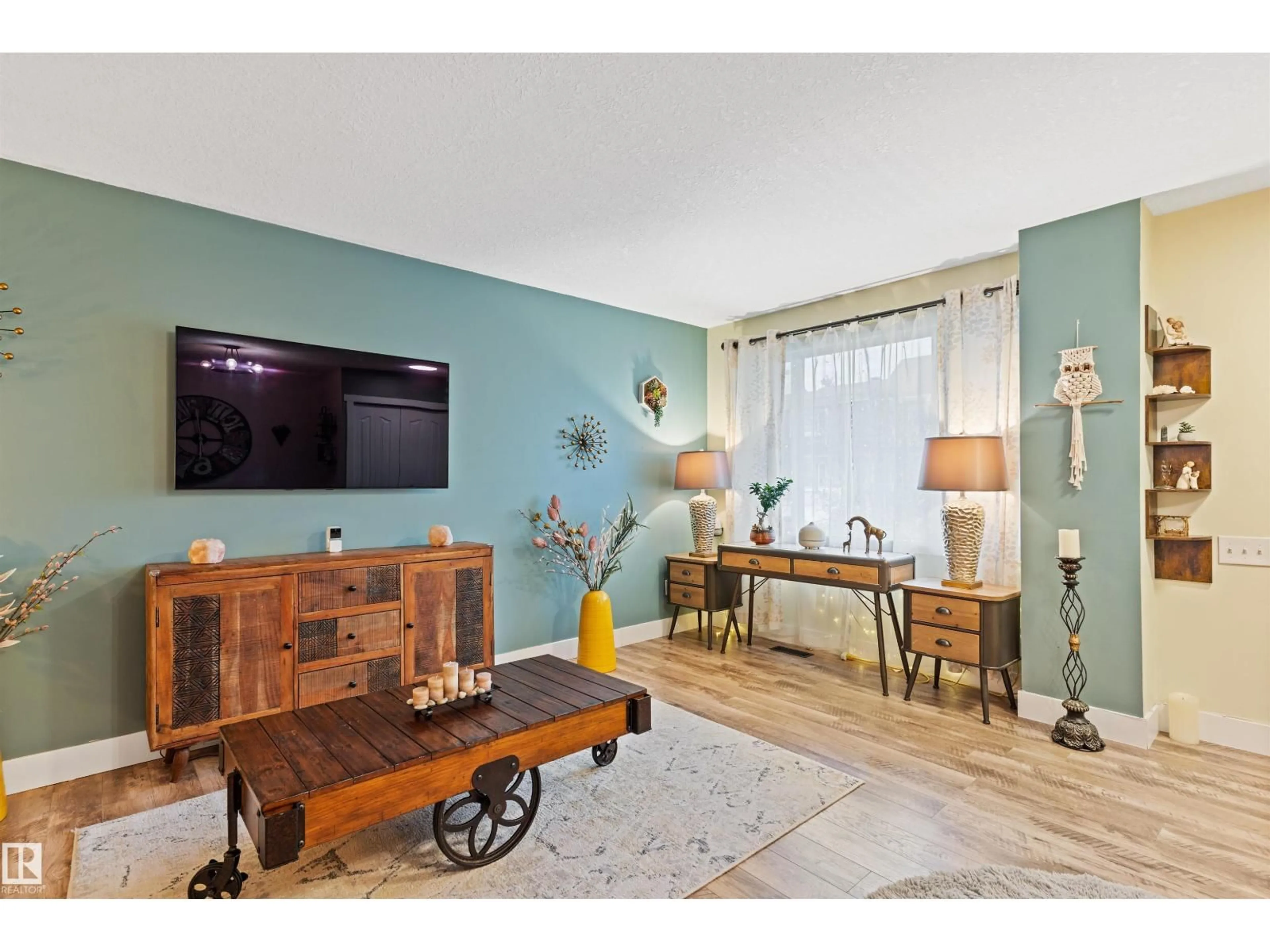 Living room with furniture, wood/laminate floor for NW - 7923 178 ST, Edmonton Alberta T5T1L3