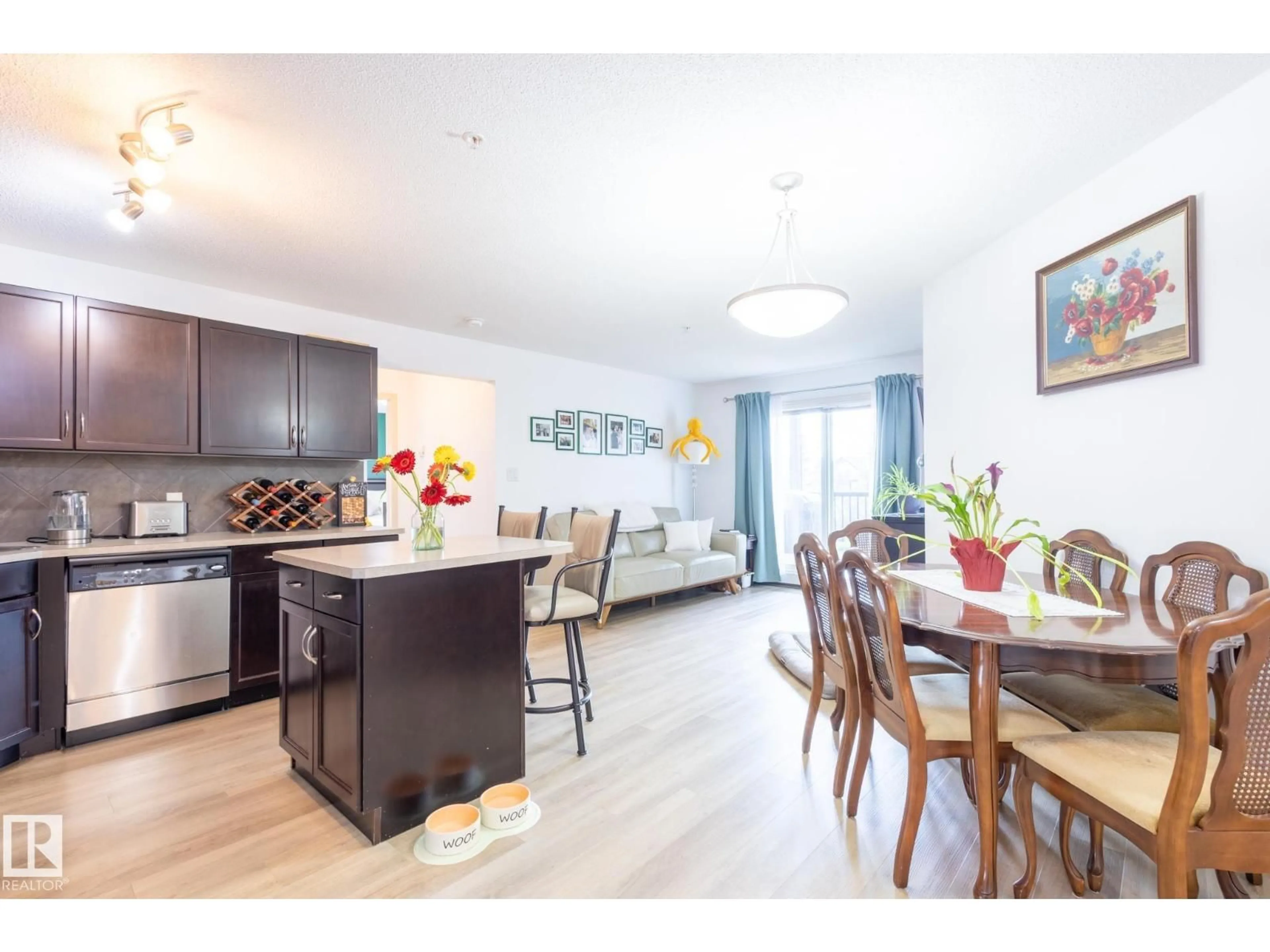 Open concept kitchen, wood/laminate floor for 5951 165 AV, Edmonton Alberta T5Y0J6