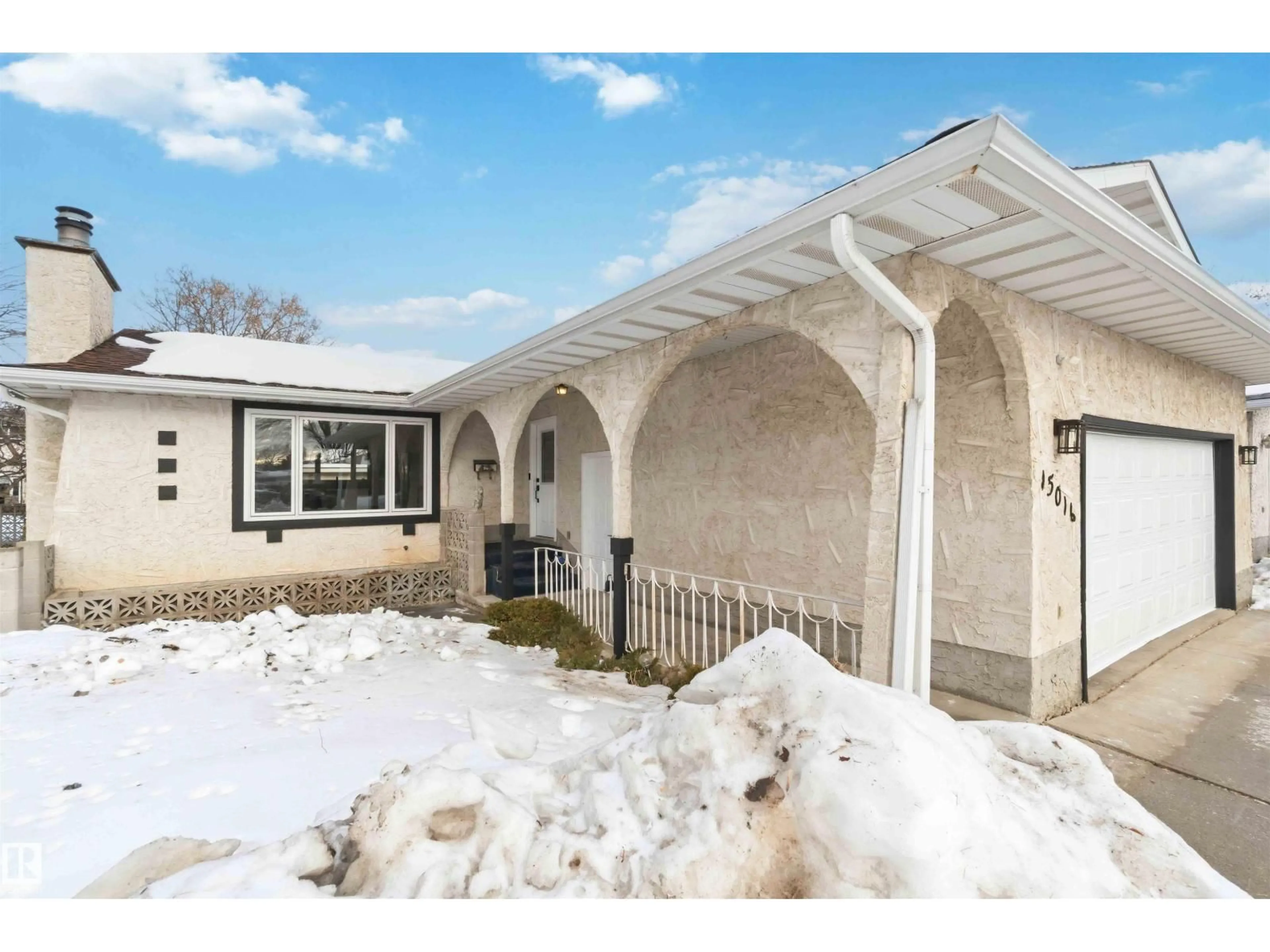 Home with vinyl exterior material, street for 15016 57 ST, Edmonton Alberta T5A2L3