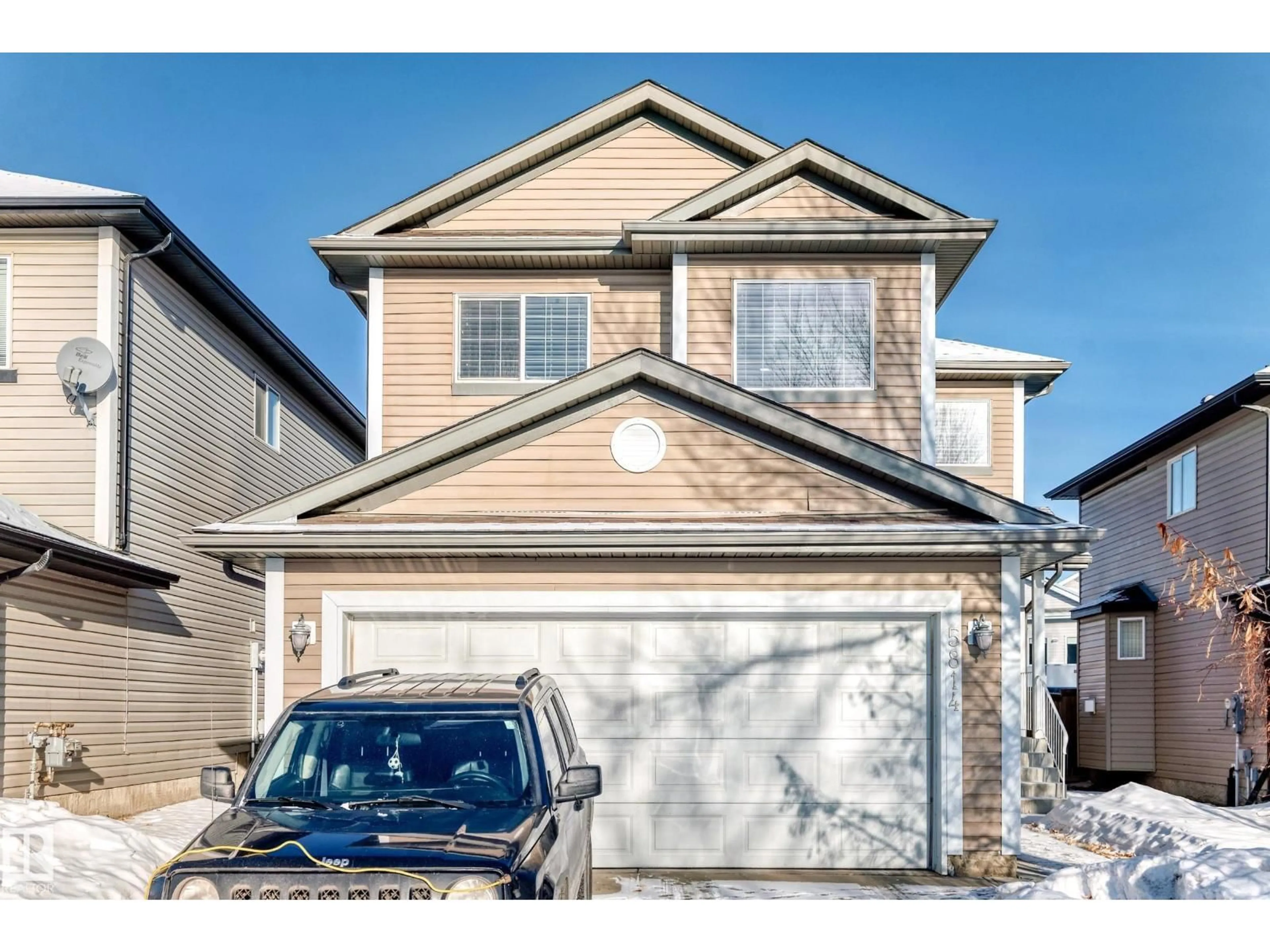 Home with vinyl exterior material, street for 5814 165 AV, Edmonton Alberta T5Y0B4