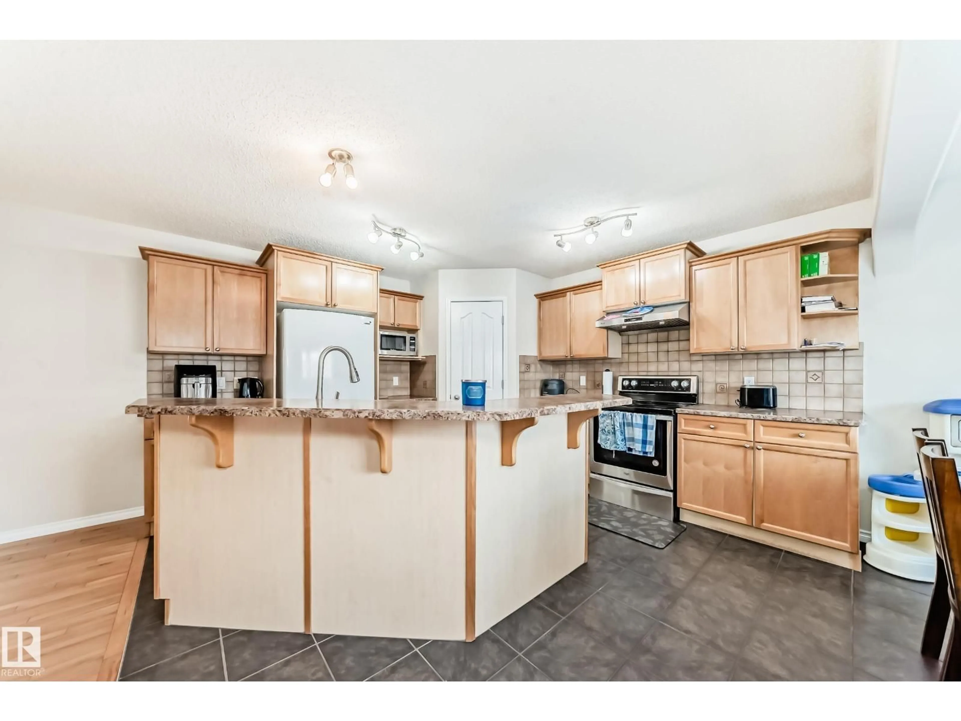 Open concept kitchen, ceramic/tile floor for 5814 165 AV, Edmonton Alberta T5Y0B4