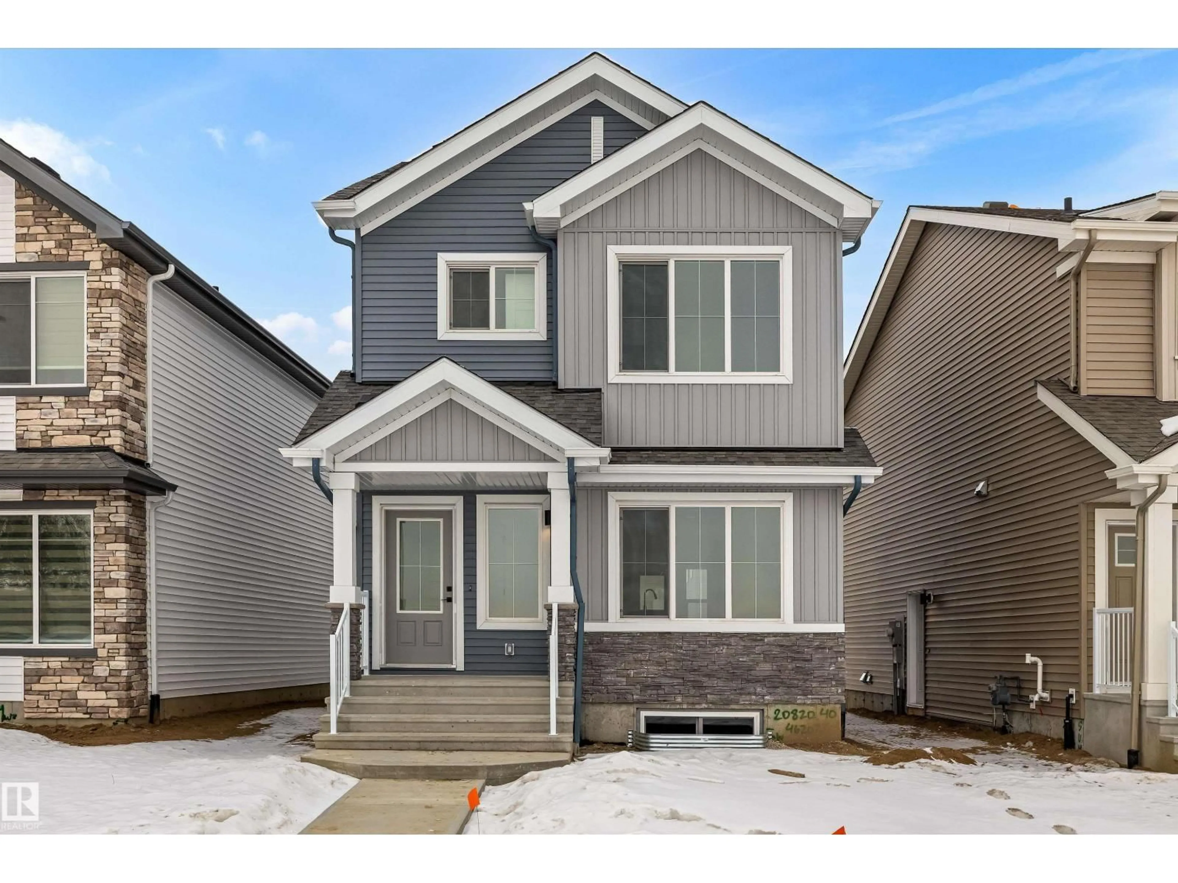 Home with vinyl exterior material, street for 19051 20 AV, Edmonton Alberta T6M3E8