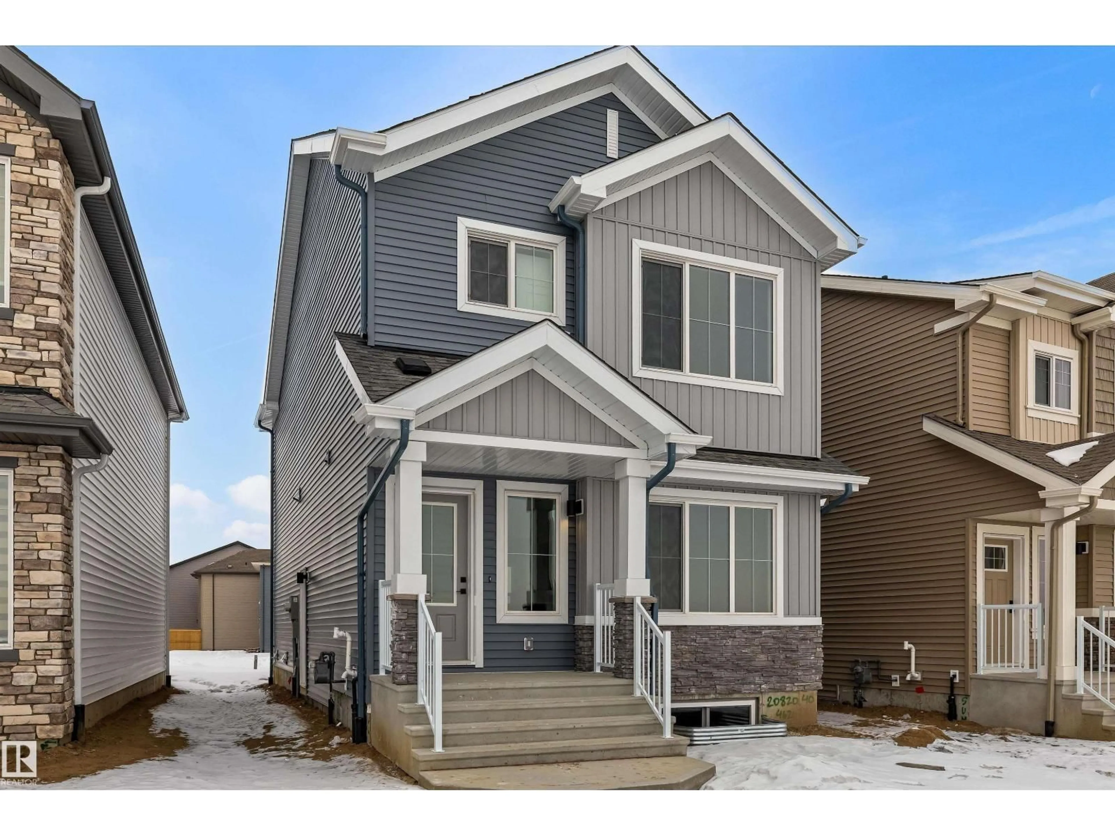 Home with vinyl exterior material, street for 19051 20 AV, Edmonton Alberta T6M3E8