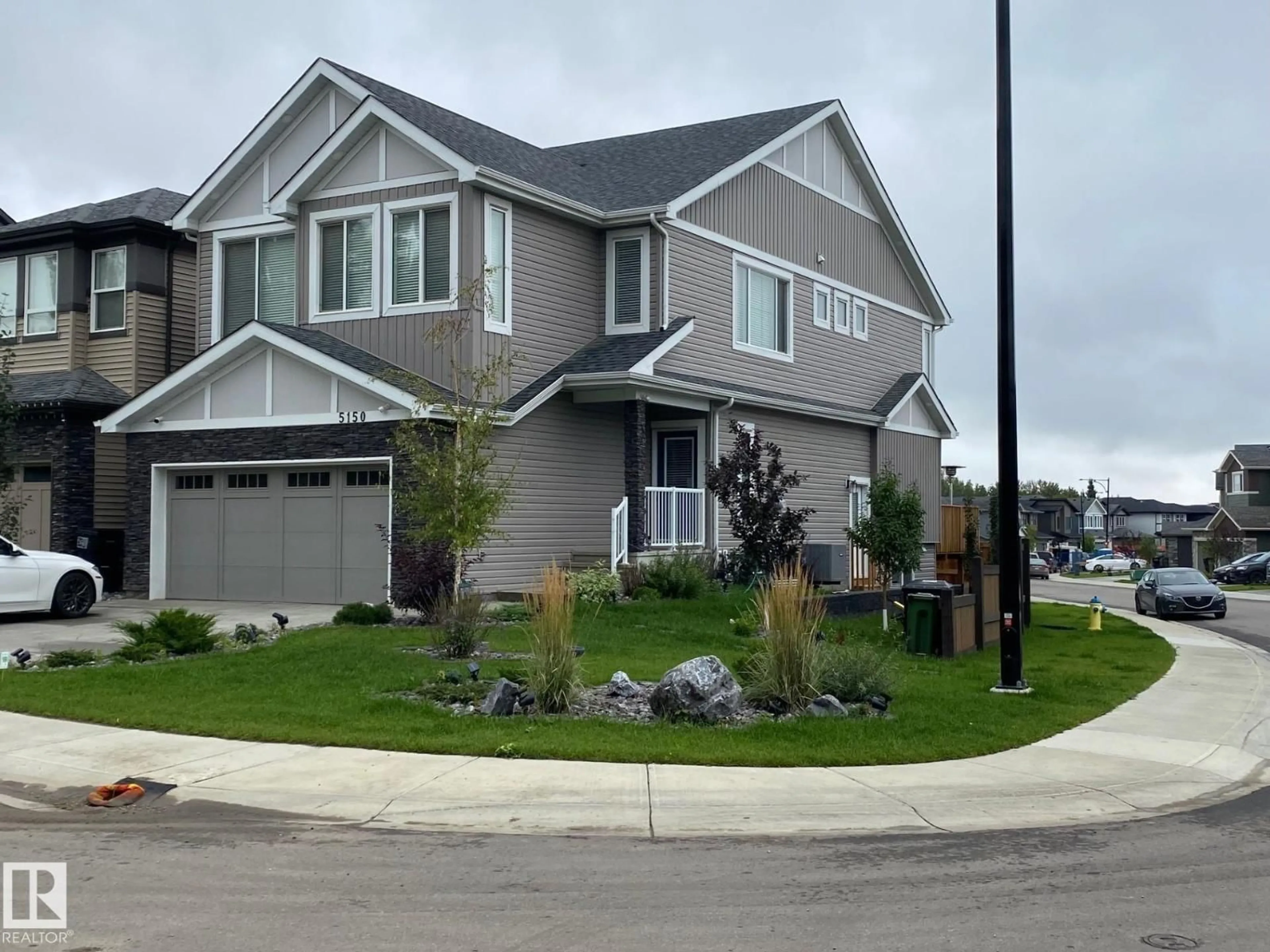 Home with vinyl exterior material, street for 5150 LARK CRESCENT, Edmonton Alberta T5S0P2