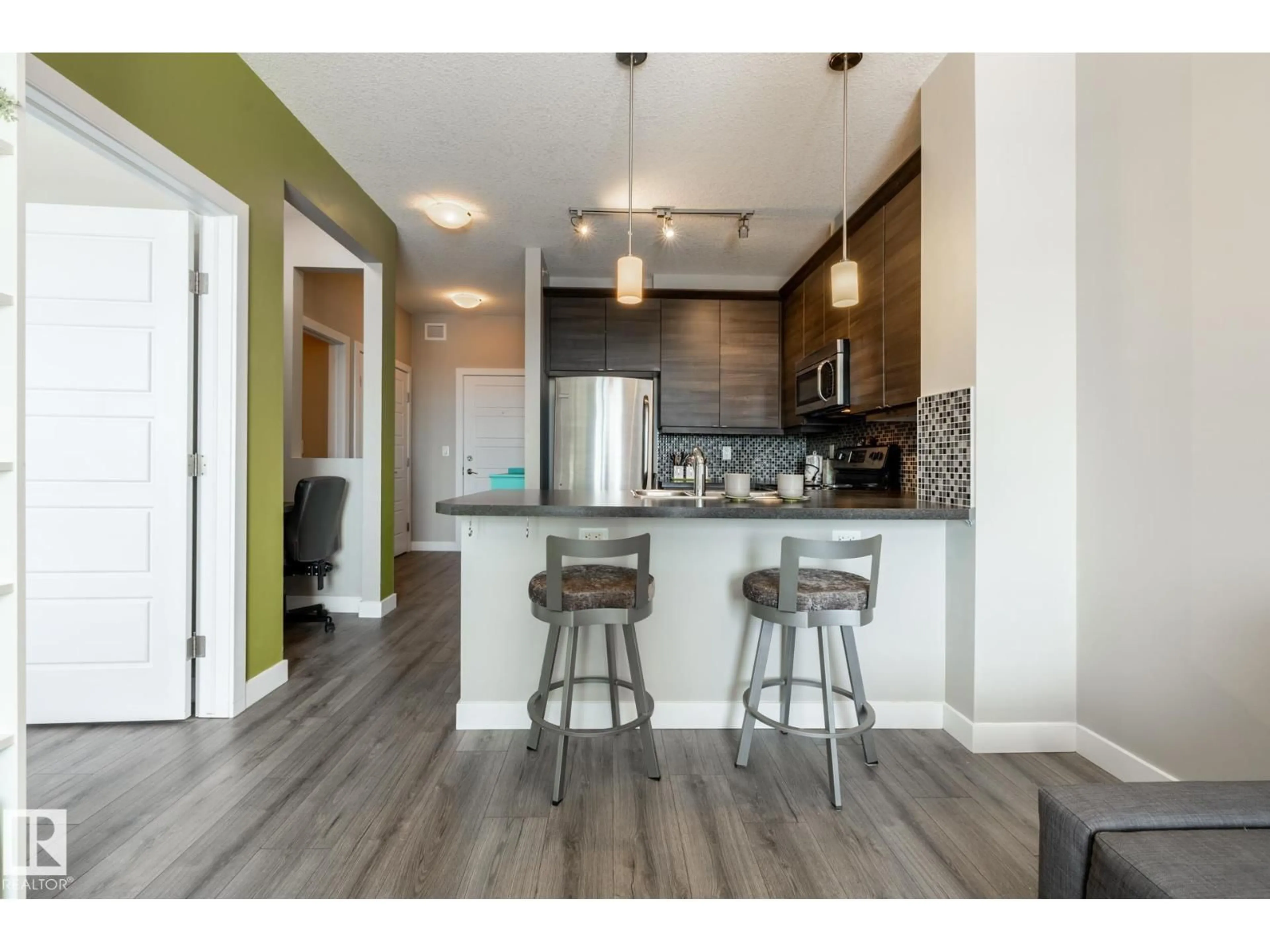 Open concept kitchen, wood/laminate floor for 407 - 2590 ANDERSON WY, Edmonton Alberta T6W0R2