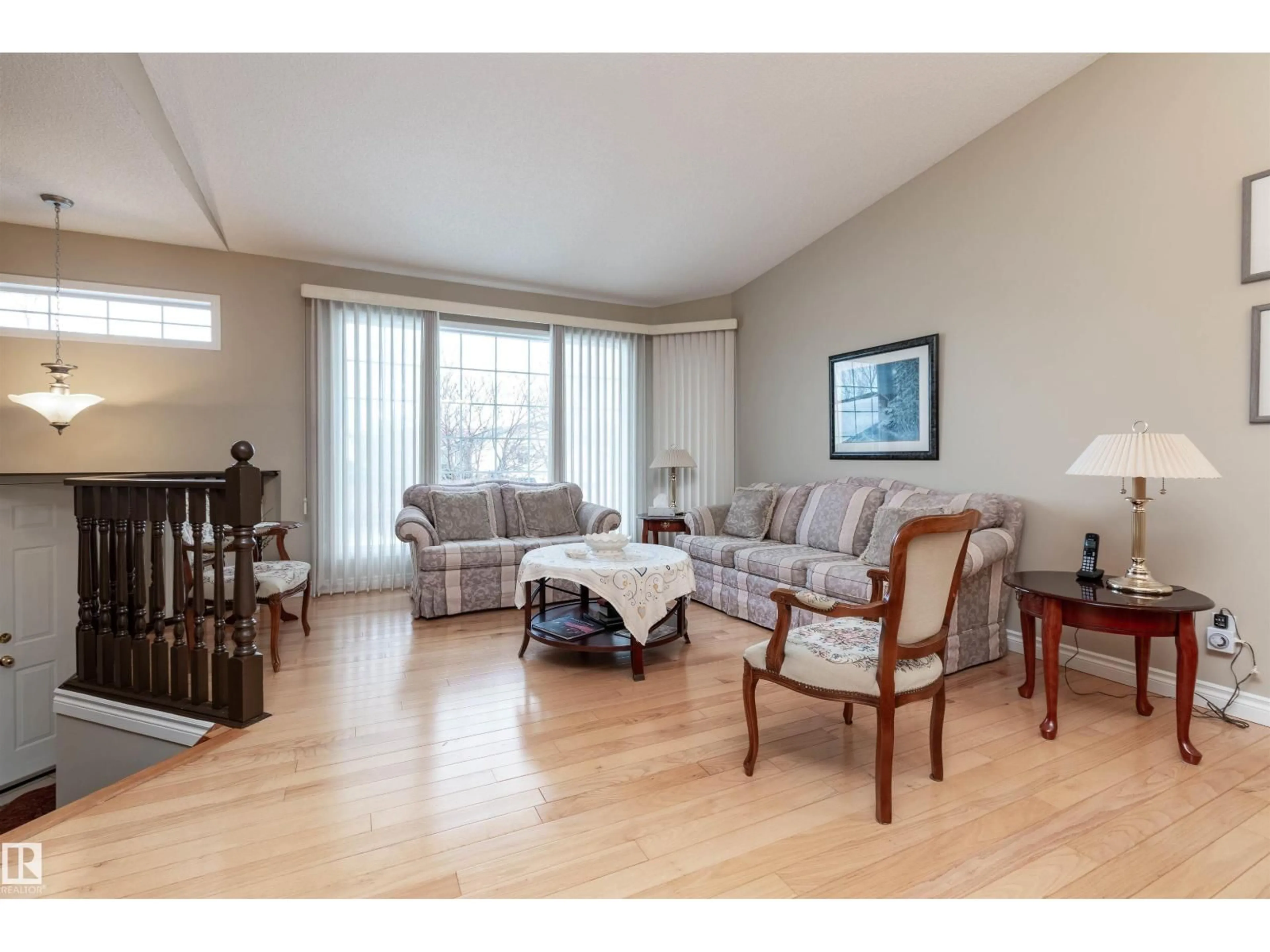 Living room with furniture, wood/laminate floor for 242 RAINBOW CR, Sherwood Park Alberta T8A5W2