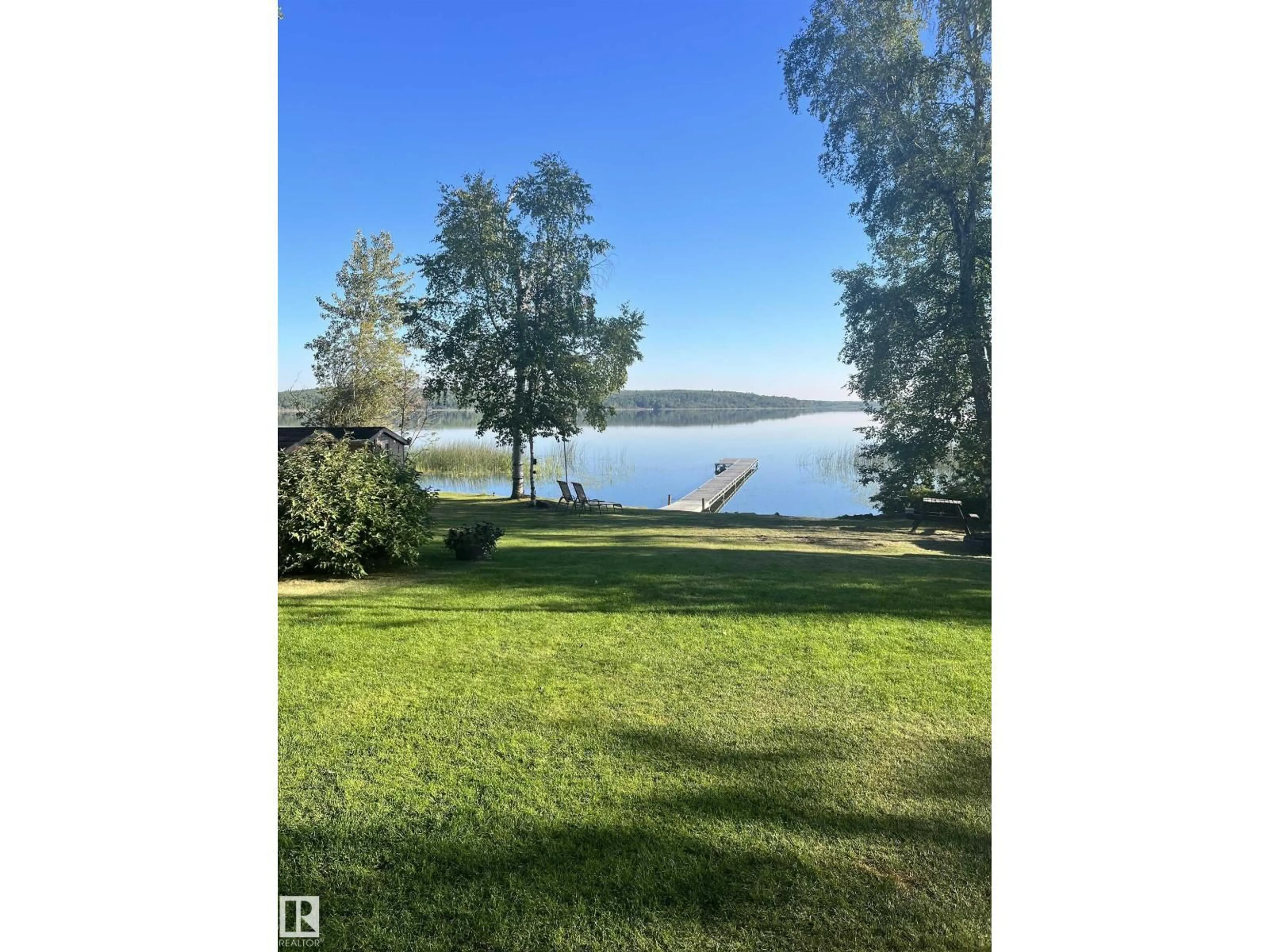 A pic from outside/outdoor area/front of a property/back of a property/a pic from drone, water/lake/river/ocean view for 20 3215 TWP ROAD ROAD, Rural Lac Ste. Anne County Alberta T0E1A0