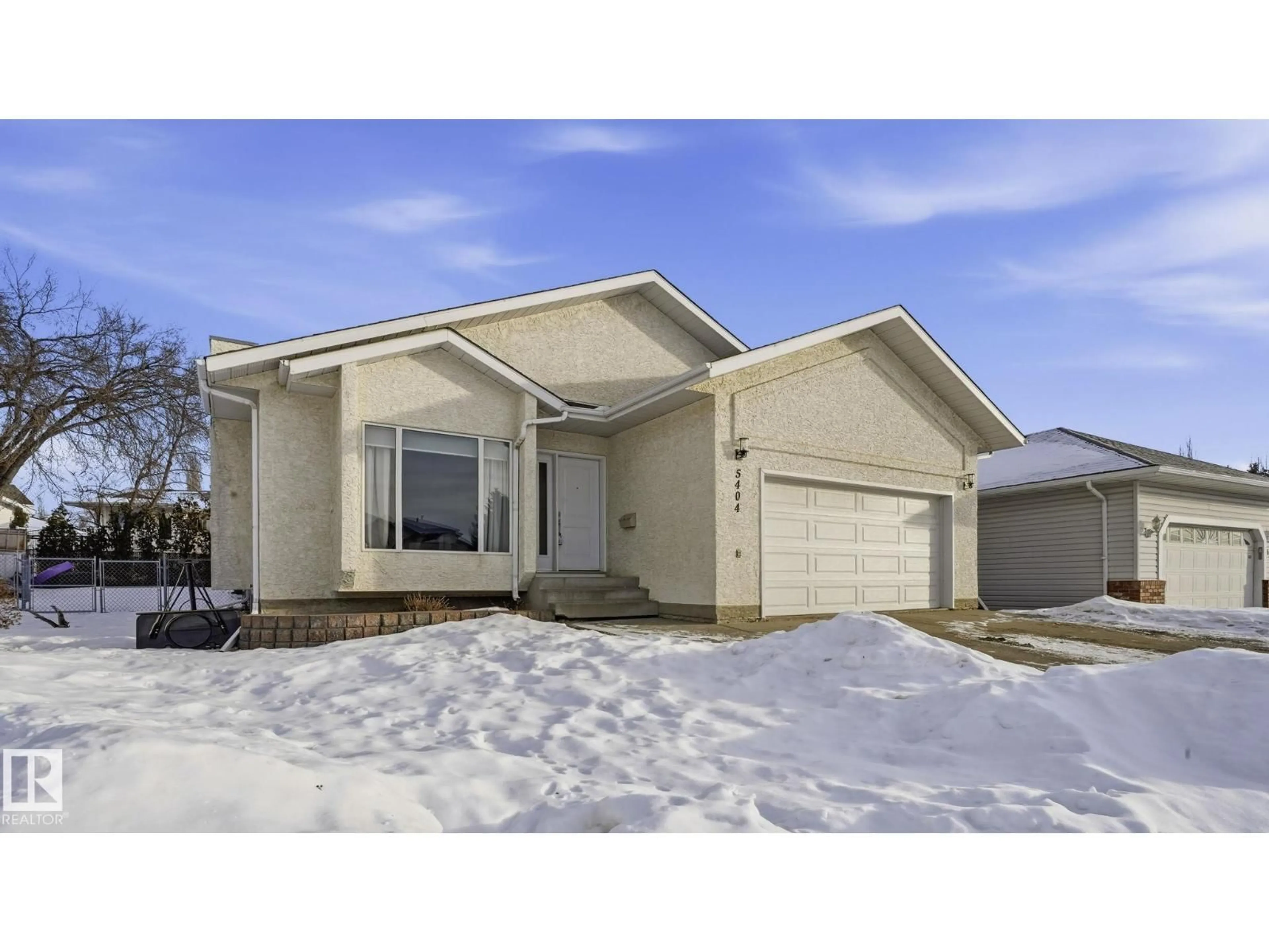 Home with vinyl exterior material, street for 5404 41 AV, Beaumont Alberta T4X1L8