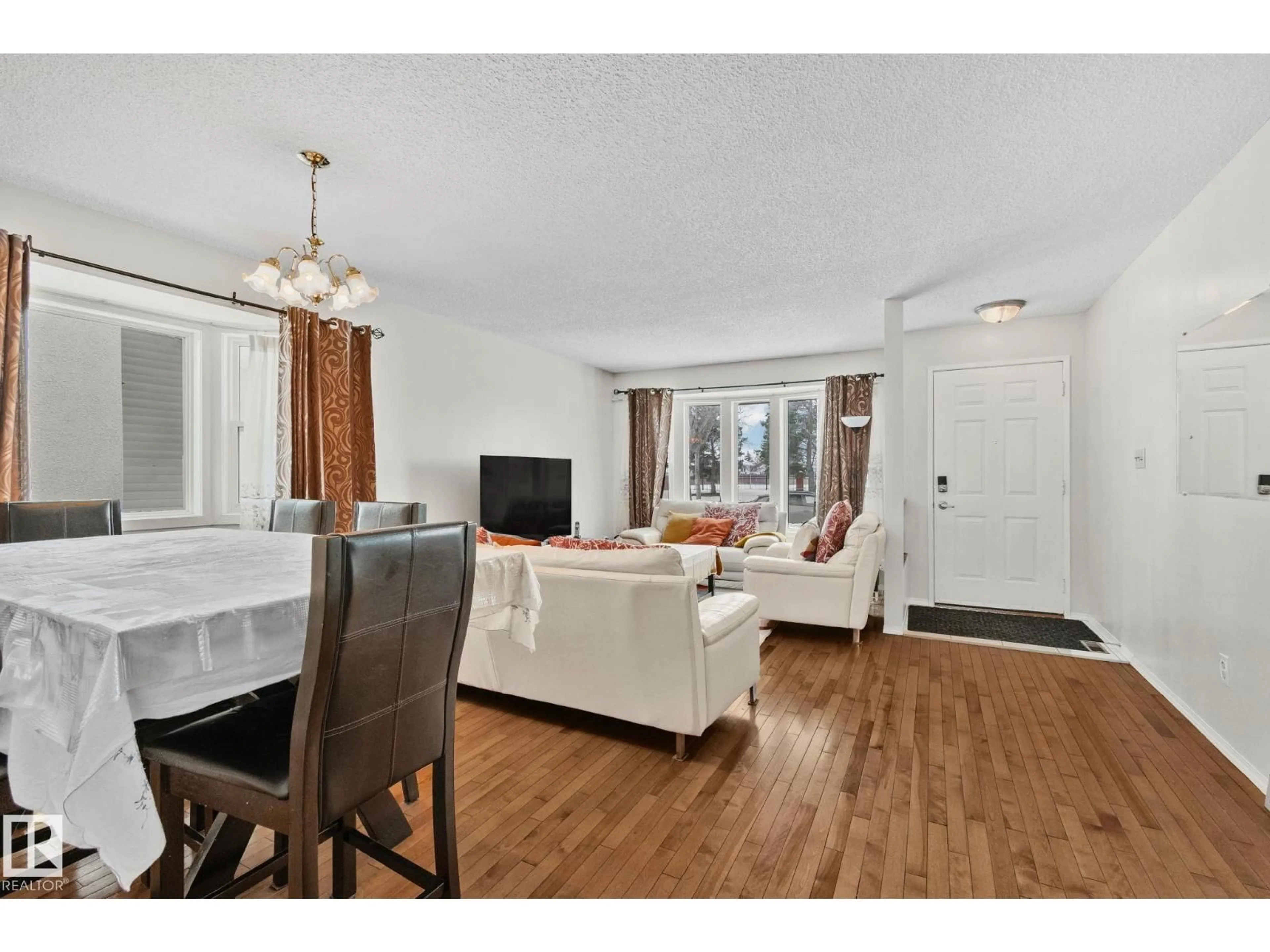 Living room with furniture, wood/laminate floor for NW - 17523 95 ST, Edmonton Alberta T5H3P9