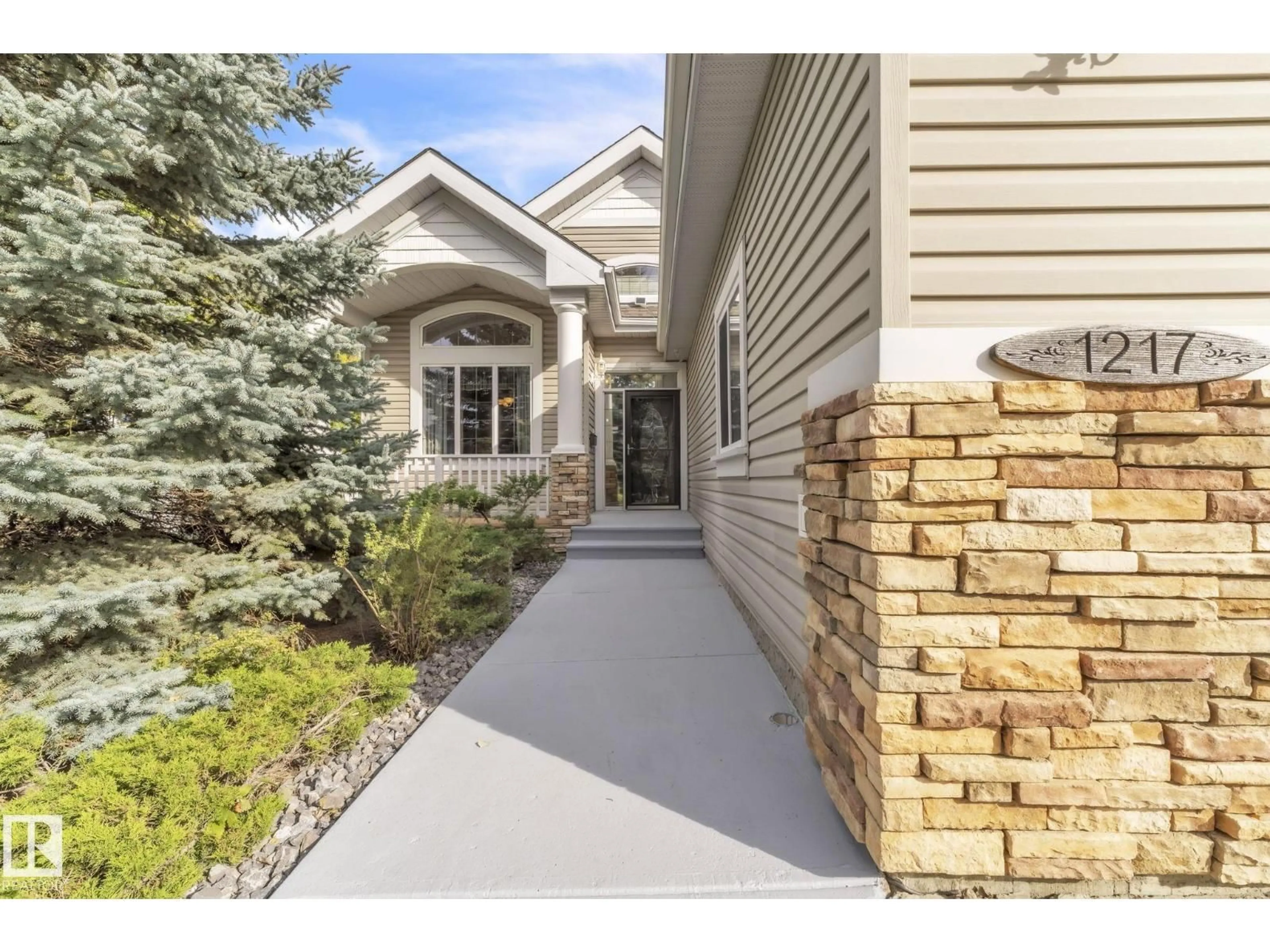 Home with vinyl exterior material, street for 1217 SUMMERSIDE DR, Edmonton Alberta T6X1C5