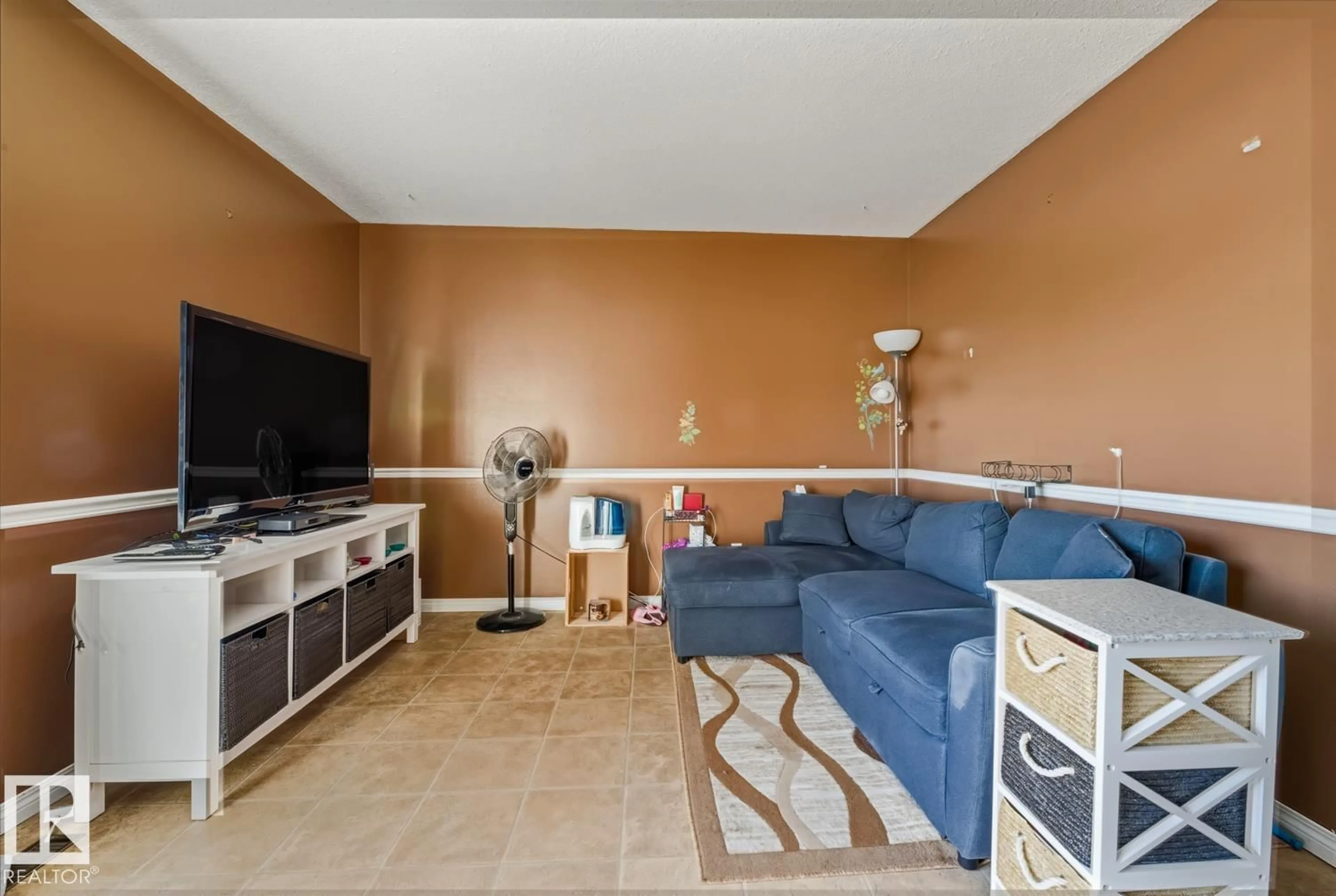 Living room with furniture, ceramic/tile floor for 18307 66 AV, Edmonton Alberta T5T1Z5