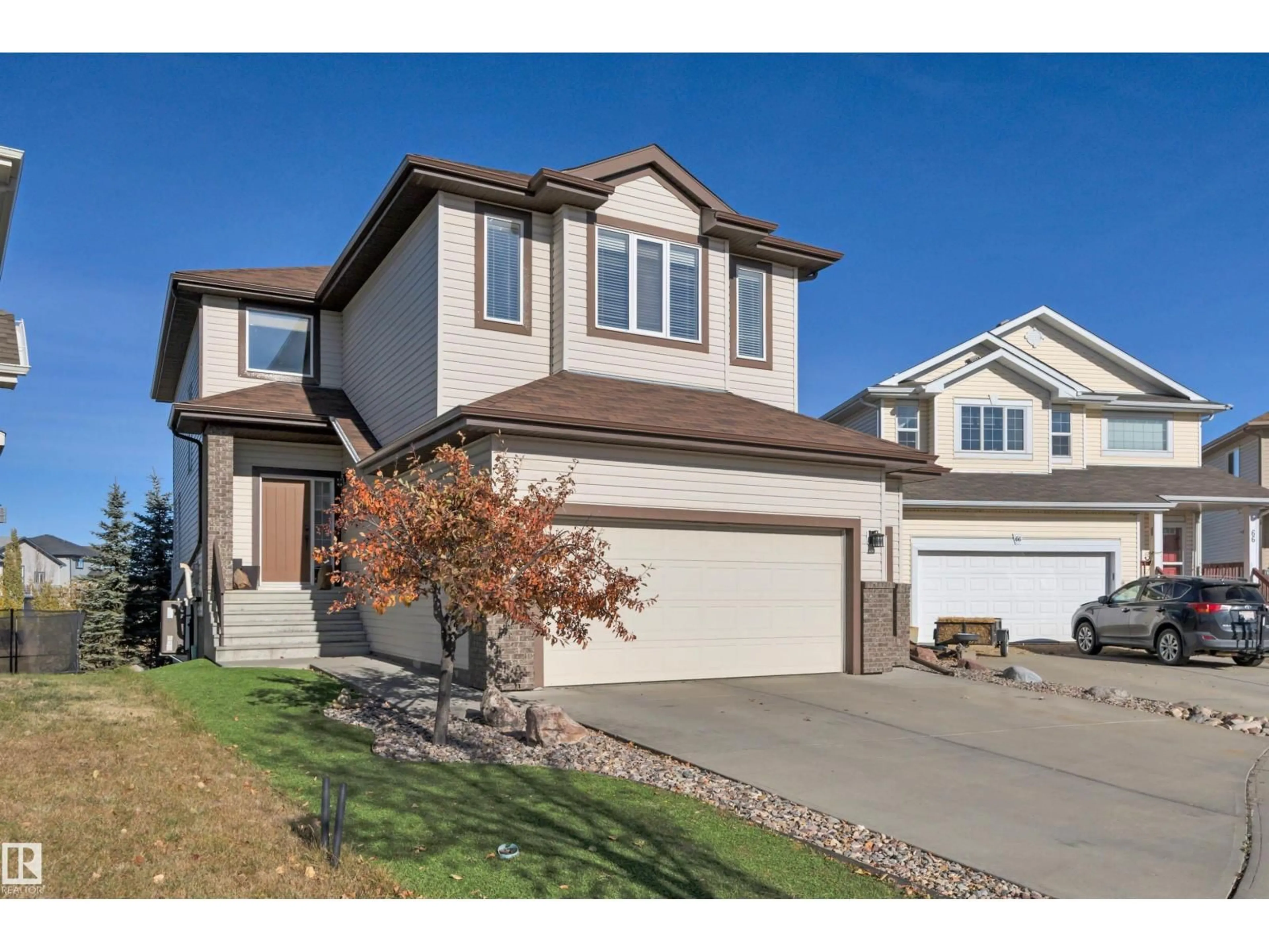 Home with vinyl exterior material, street for 68 DALQUIST BA, Leduc Alberta T9E0N5