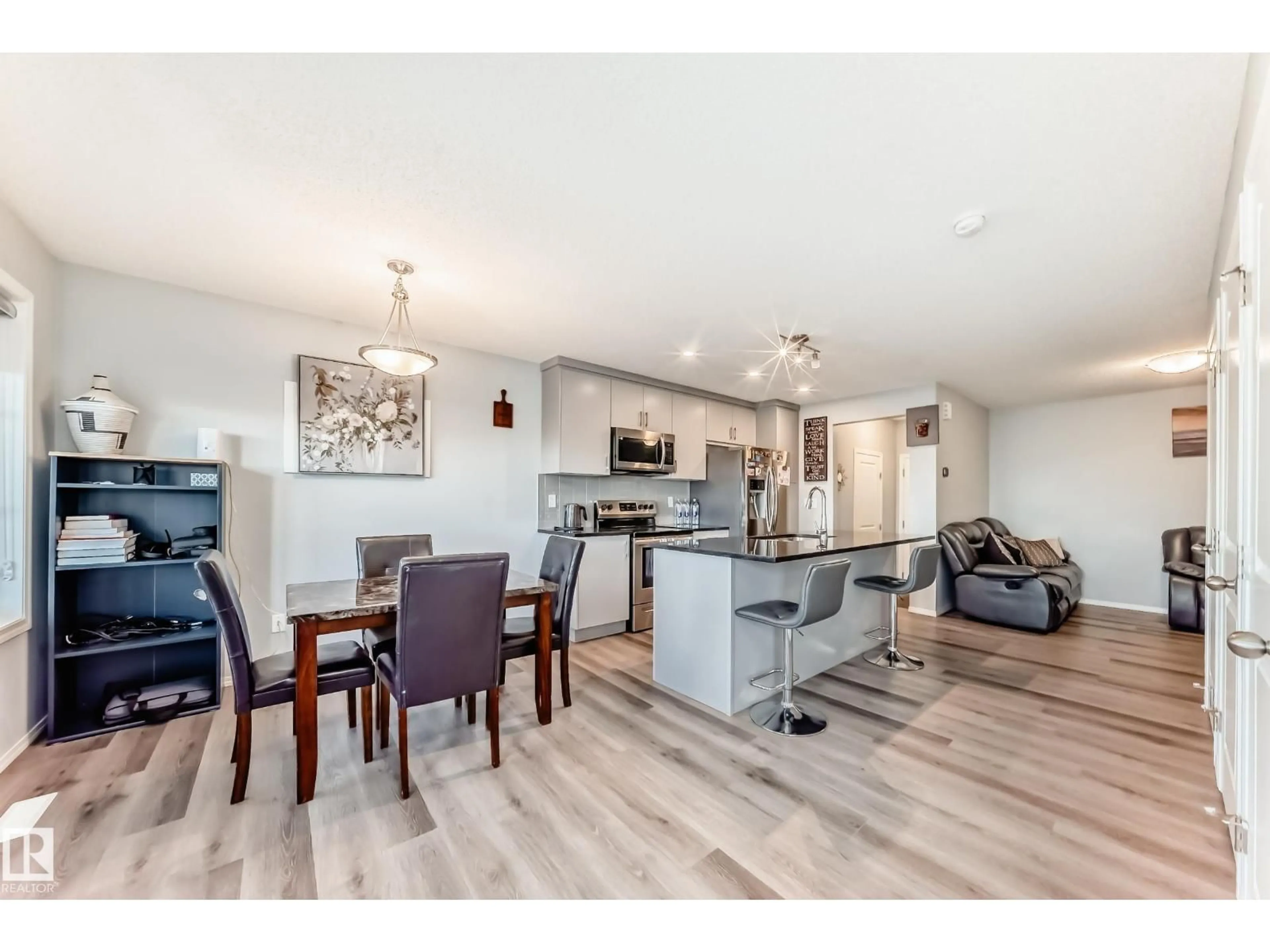 Open concept kitchen, wood/laminate floor for 1002 STILLWATER BV, Edmonton Alberta T6M1M8