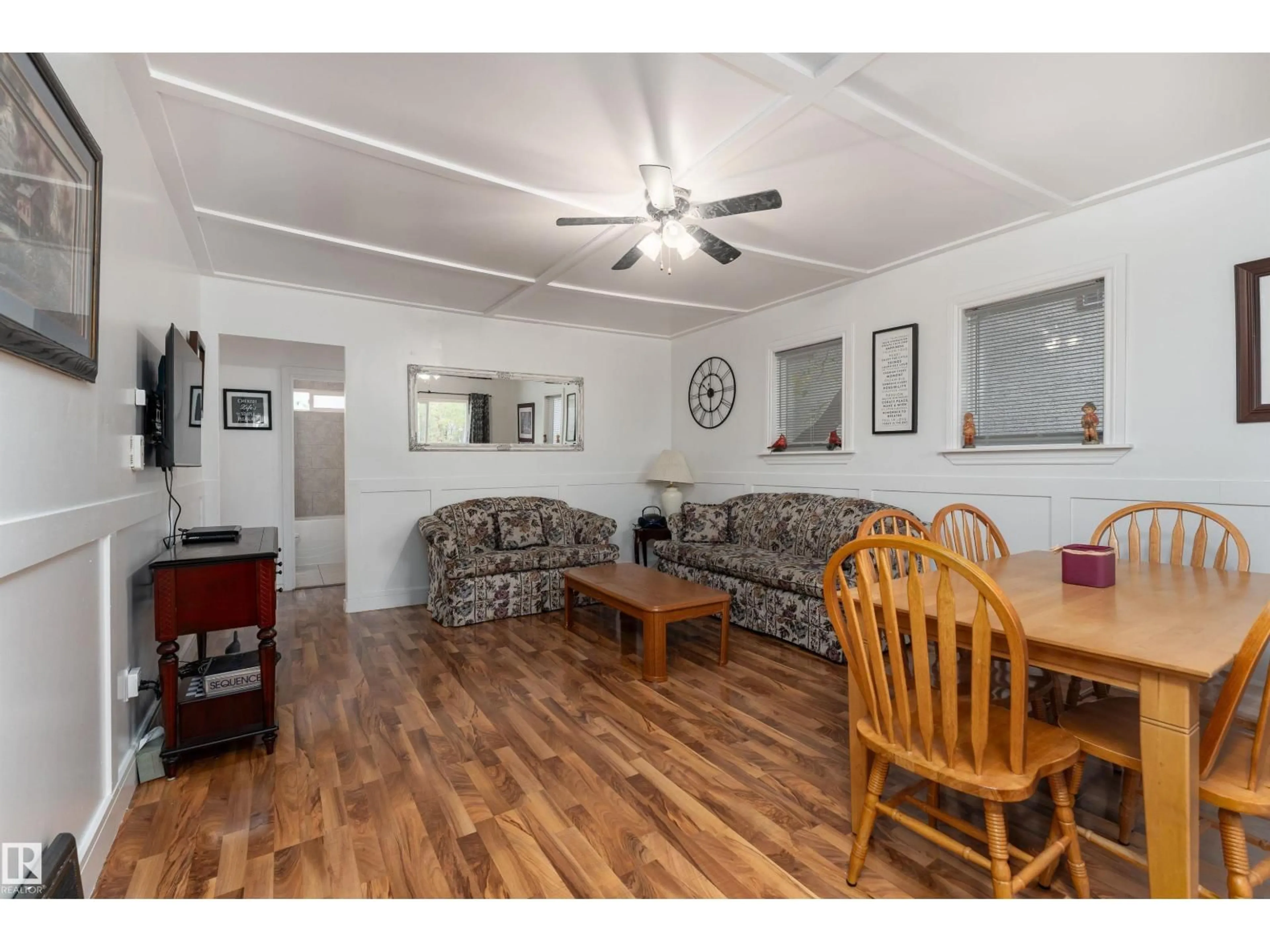 Living room with furniture, wood/laminate floor for NW - 11539 101 ST, Edmonton Alberta T5G2B2