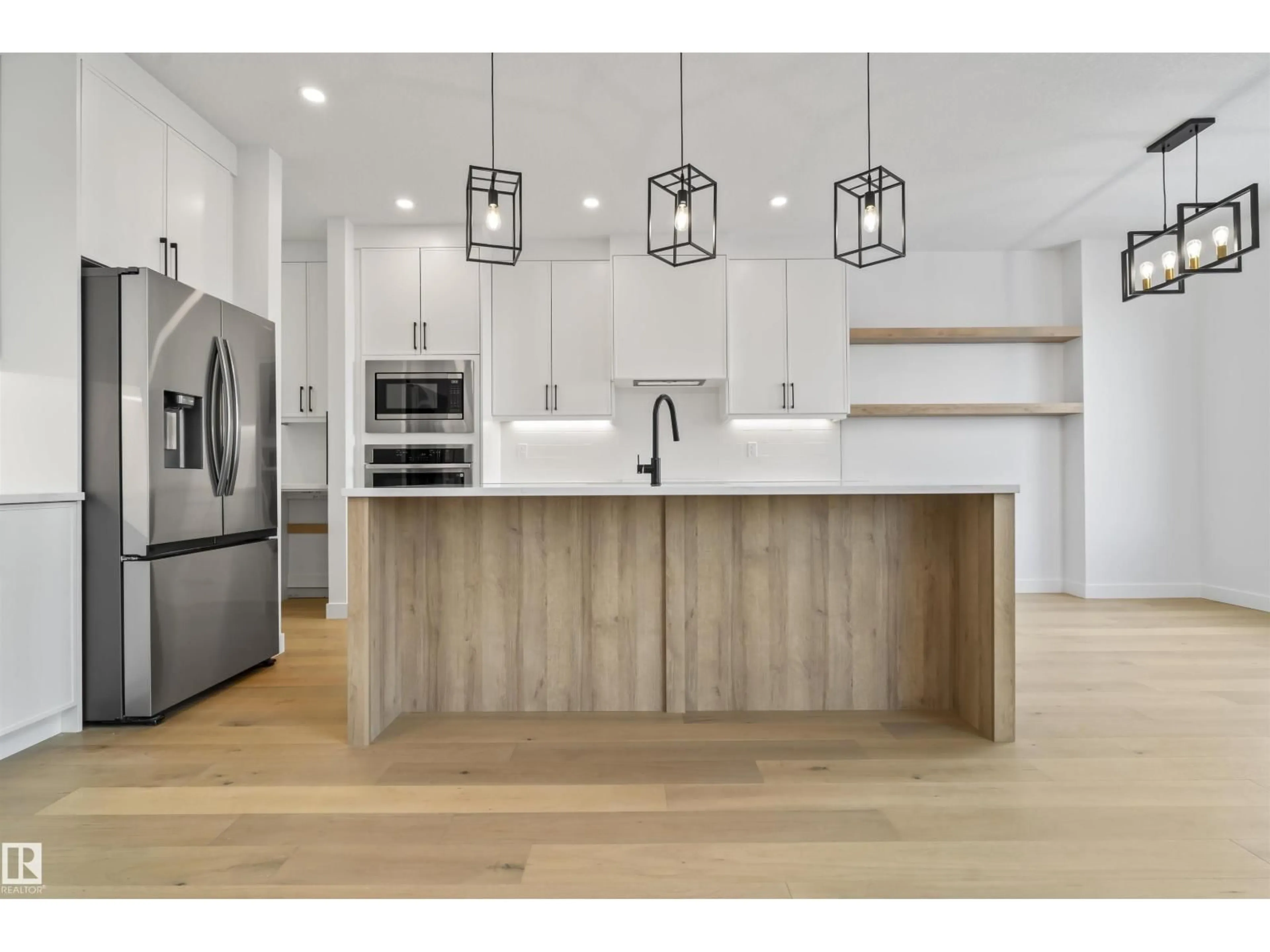 Open concept kitchen, wood/laminate floor for 22526 98A AV, Edmonton Alberta T5T7R7