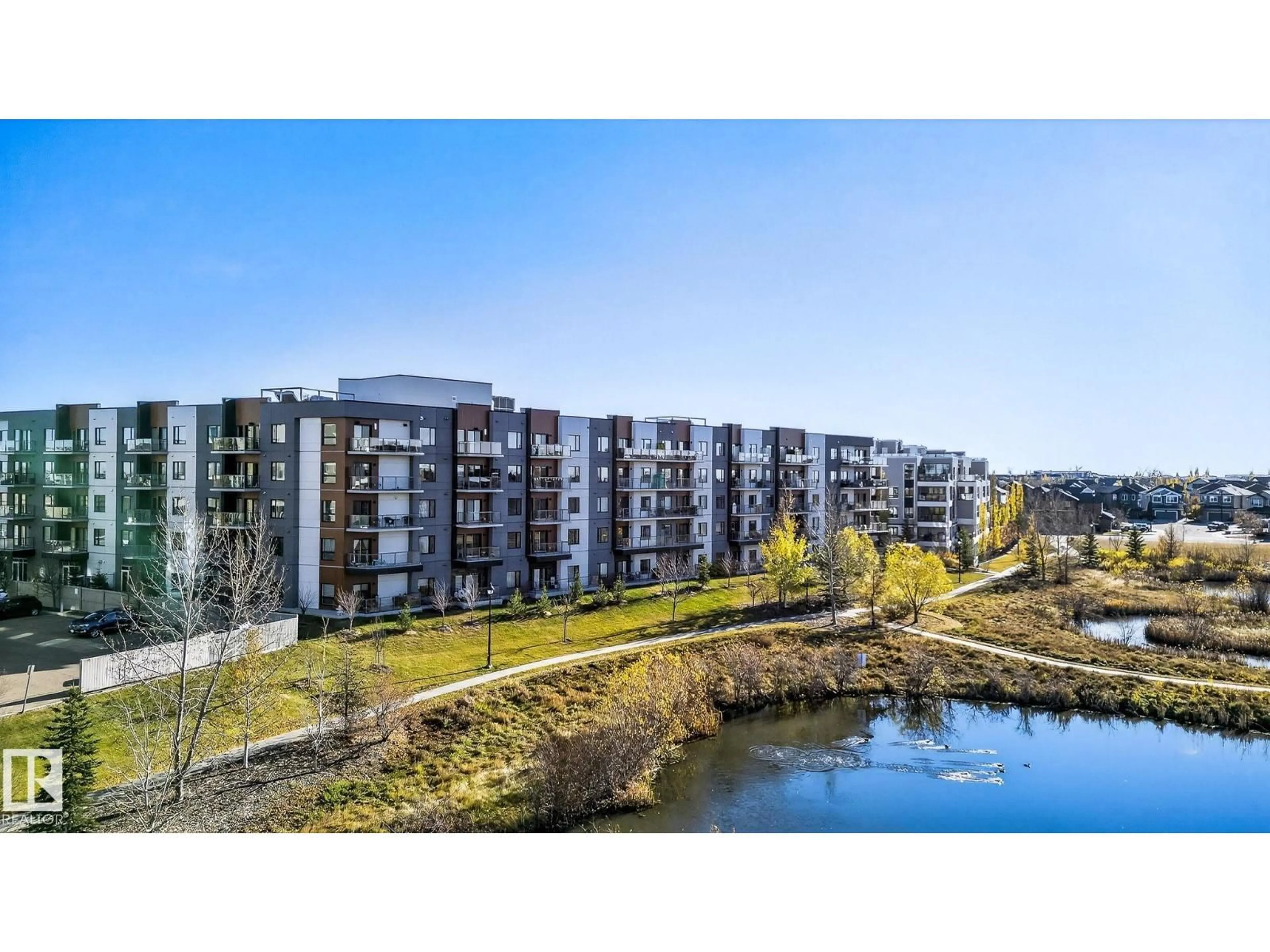 A pic from outside/outdoor area/front of a property/back of a property/a pic from drone, water/lake/river/ocean view for #218 - 1316 WINDERMERE WY, Edmonton Alberta T6W2J3