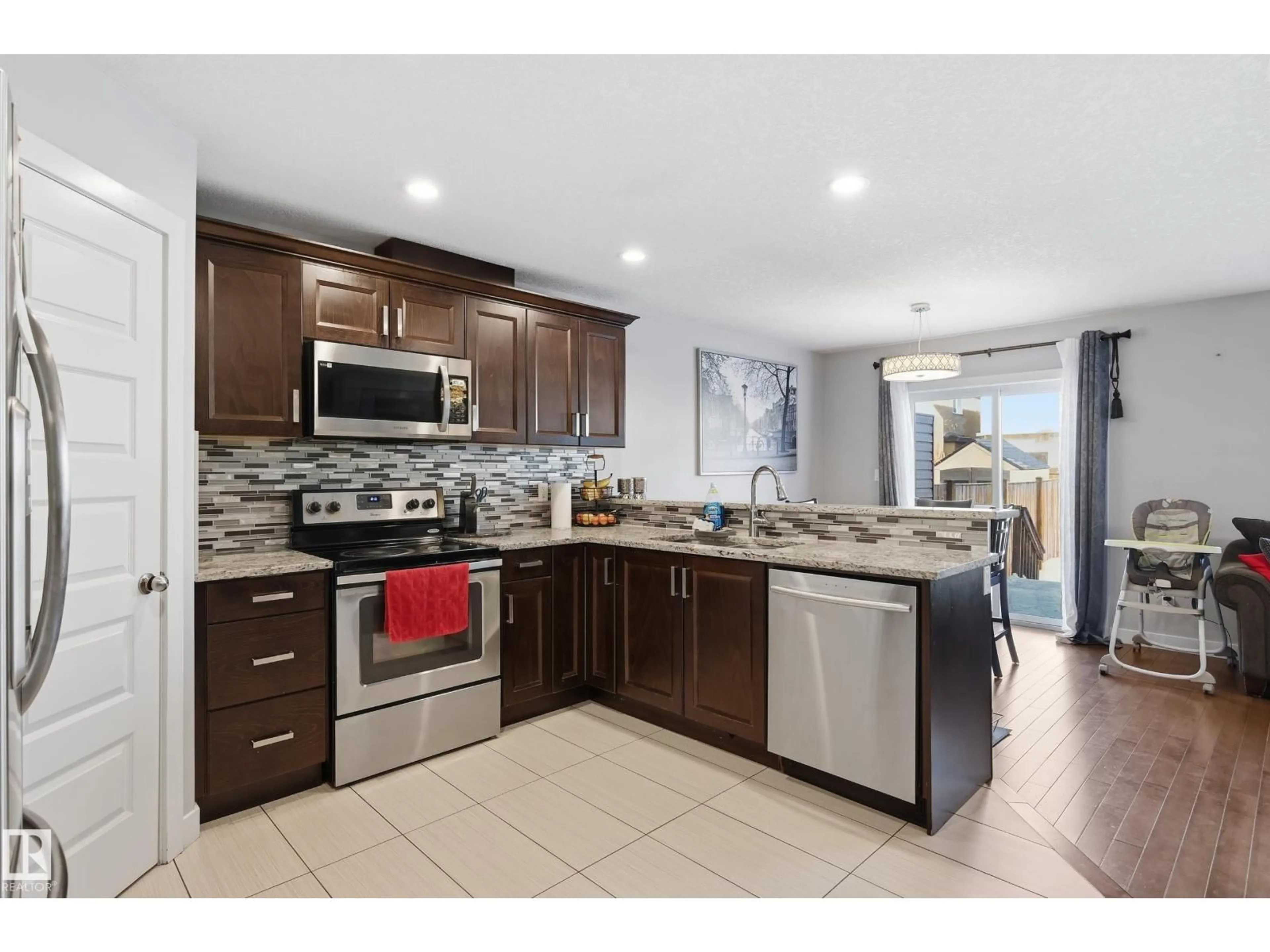 Open concept kitchen, ceramic/tile floor for NW - 5978 167C AV, Edmonton Alberta T5Y0P4