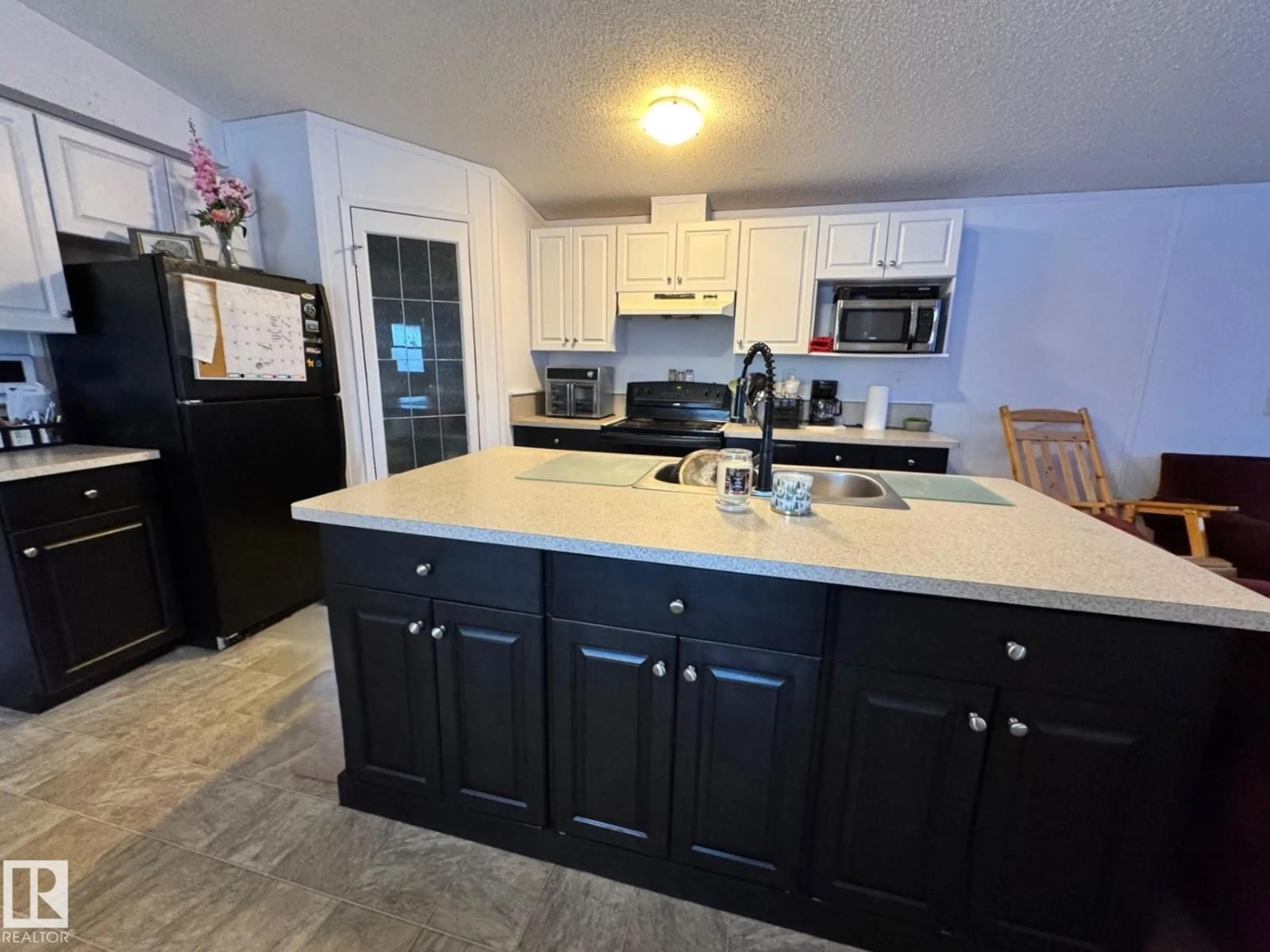 Open concept kitchen, ceramic/tile floor for 4732 54 AV, Wildwood Alberta T0E2M0