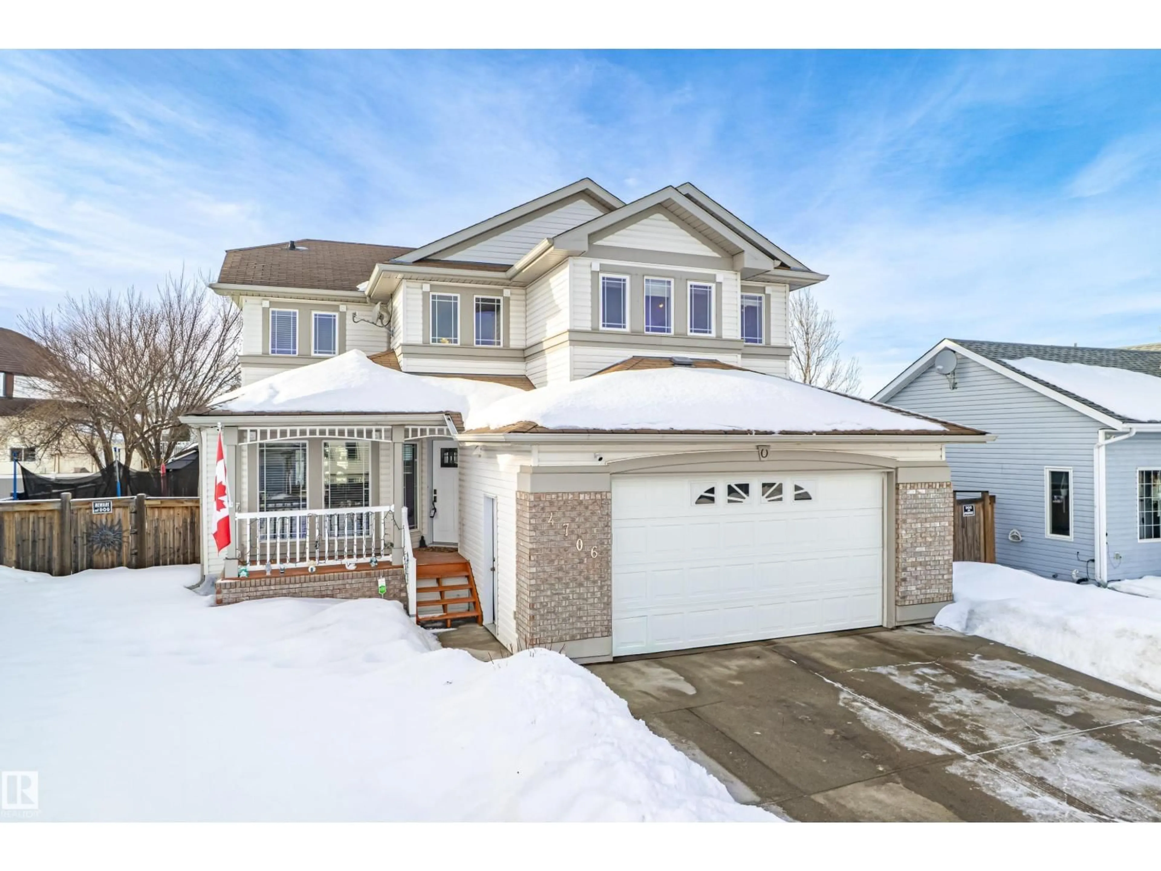 Home with vinyl exterior material, street for 4706 47 ST, Legal Alberta T0G1L0