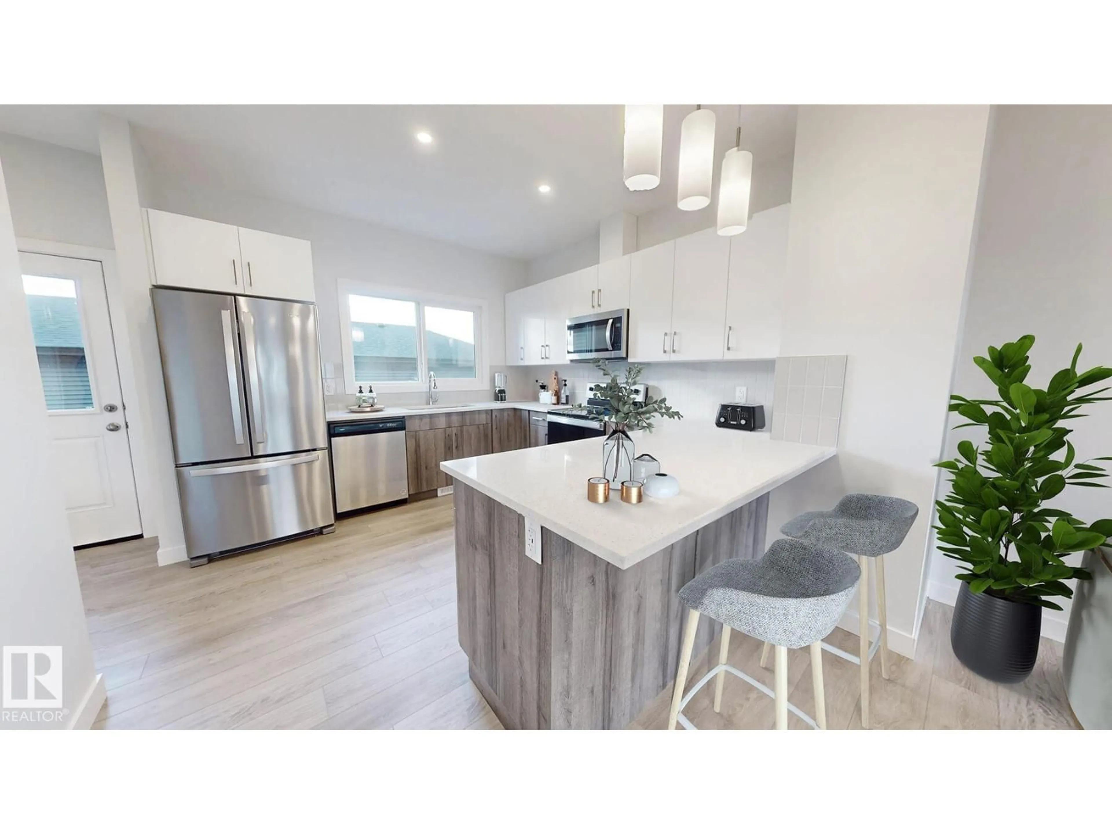 Open concept kitchen, wood/laminate floor for 691 CAMBRIAN BV, Sherwood Park Alberta T8H3B7