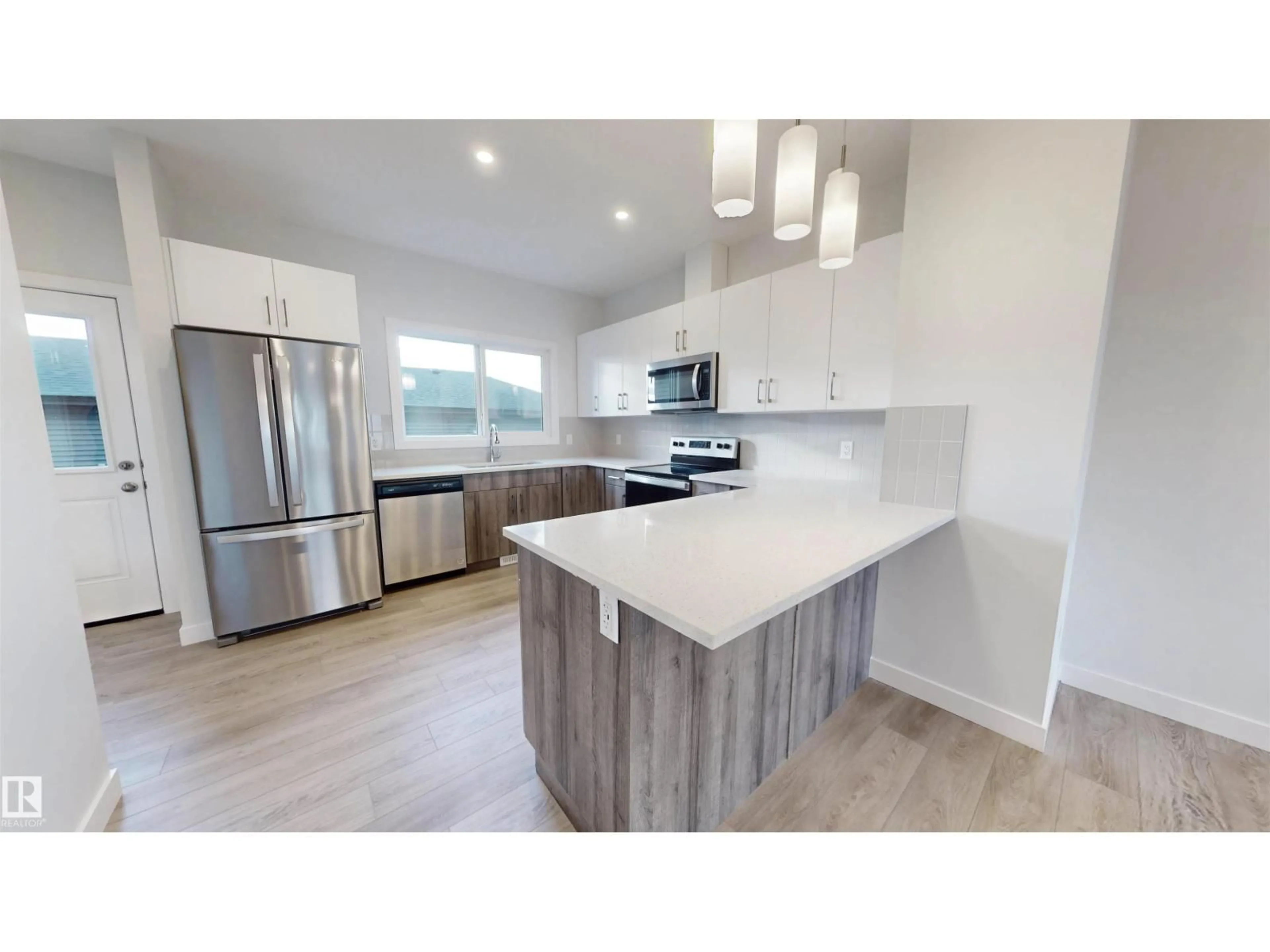 Open concept kitchen, wood/laminate floor for 691 CAMBRIAN BV, Sherwood Park Alberta T8H3B7